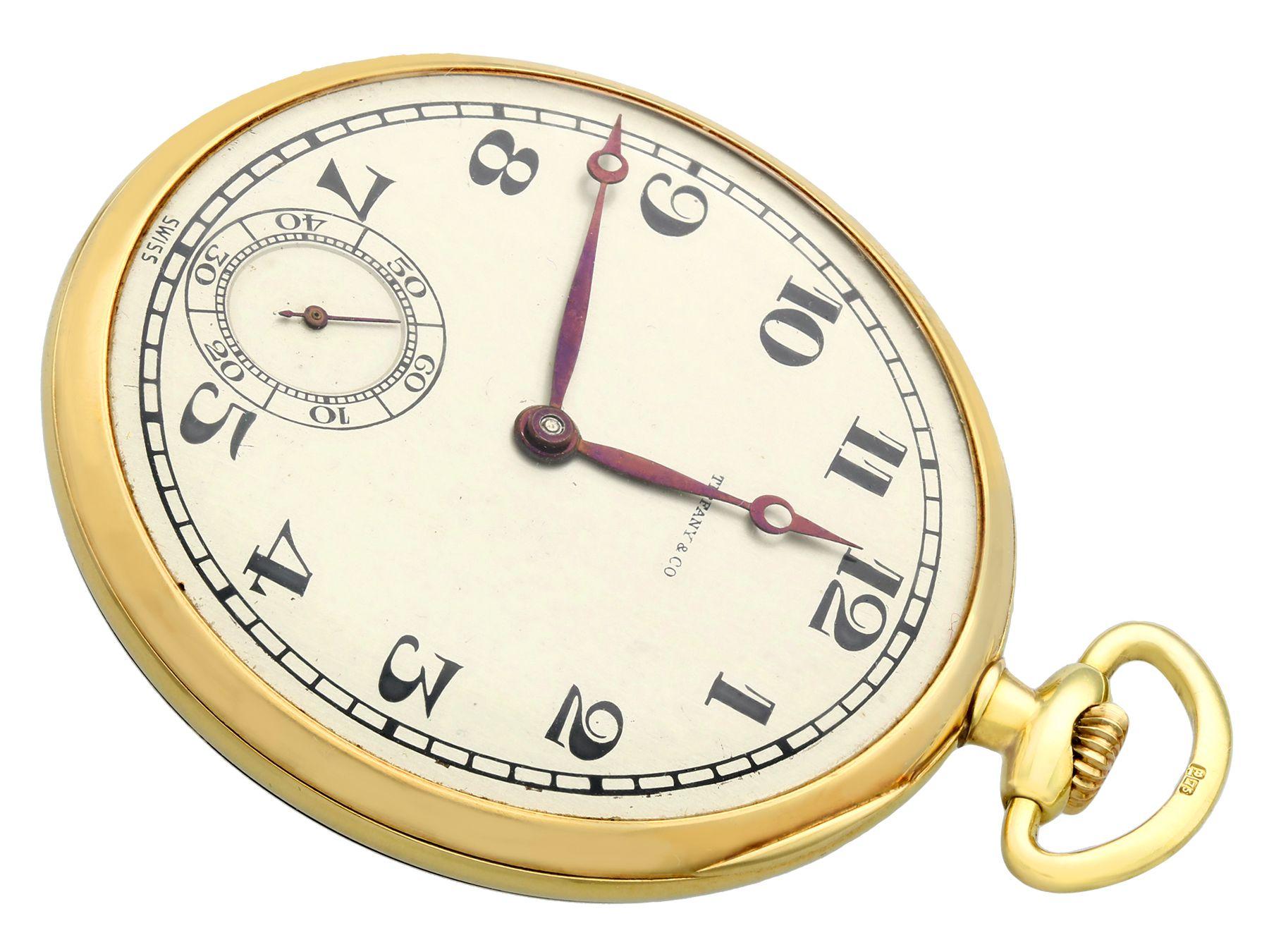 A stunning antique 18 karat yellow gold open-face pocket watch by Tiffany & Co.; part of our diverse antique jewellery and estate jewelry collections.

This fine and impressive open-face gold pocket watch has been crafted in 18k yellow gold.

The