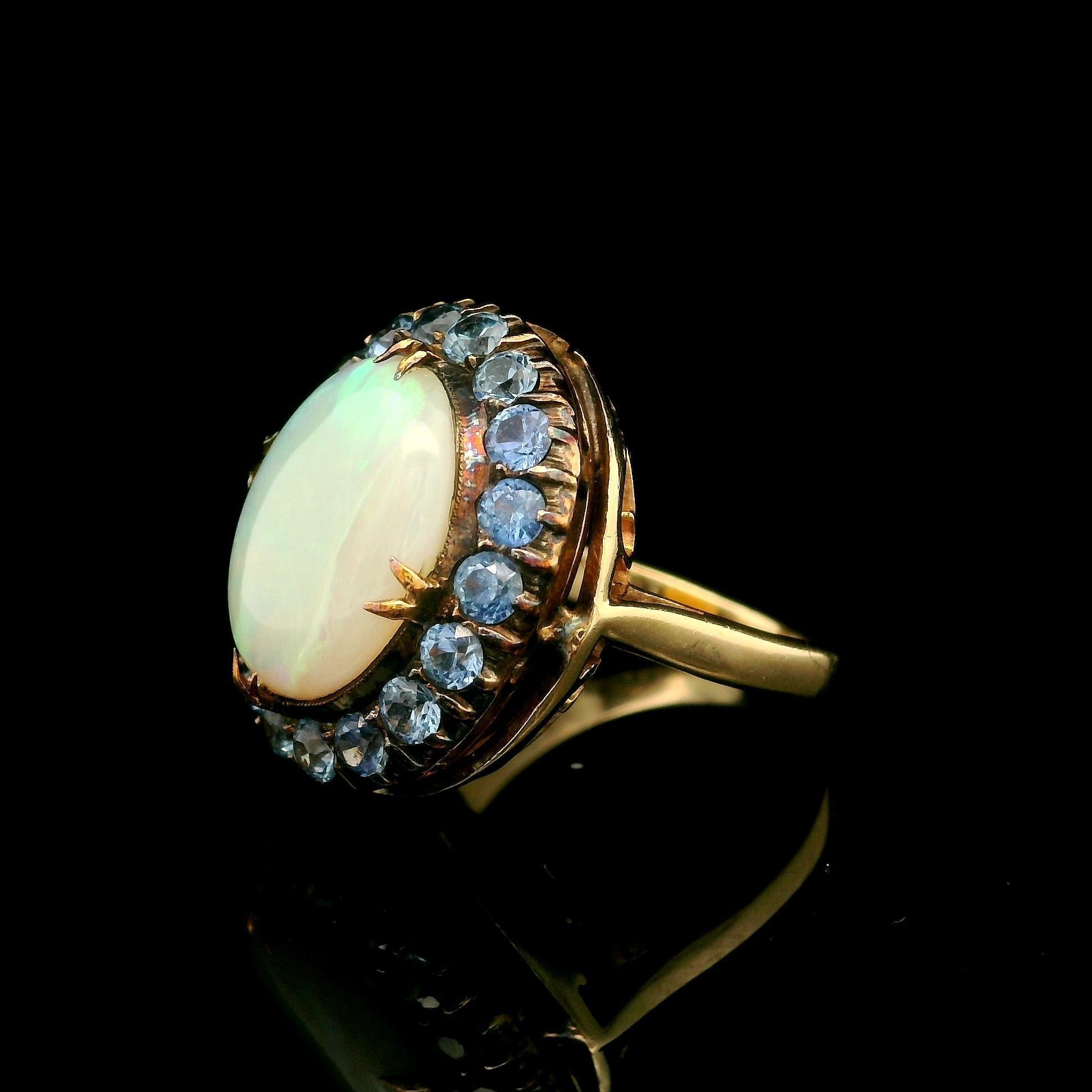 Antique Yellow Gold Oval Cabochon Opal w/ Cornflower Sapphire Halo Cocktail Ring In Good Condition For Sale In Montclair, NJ