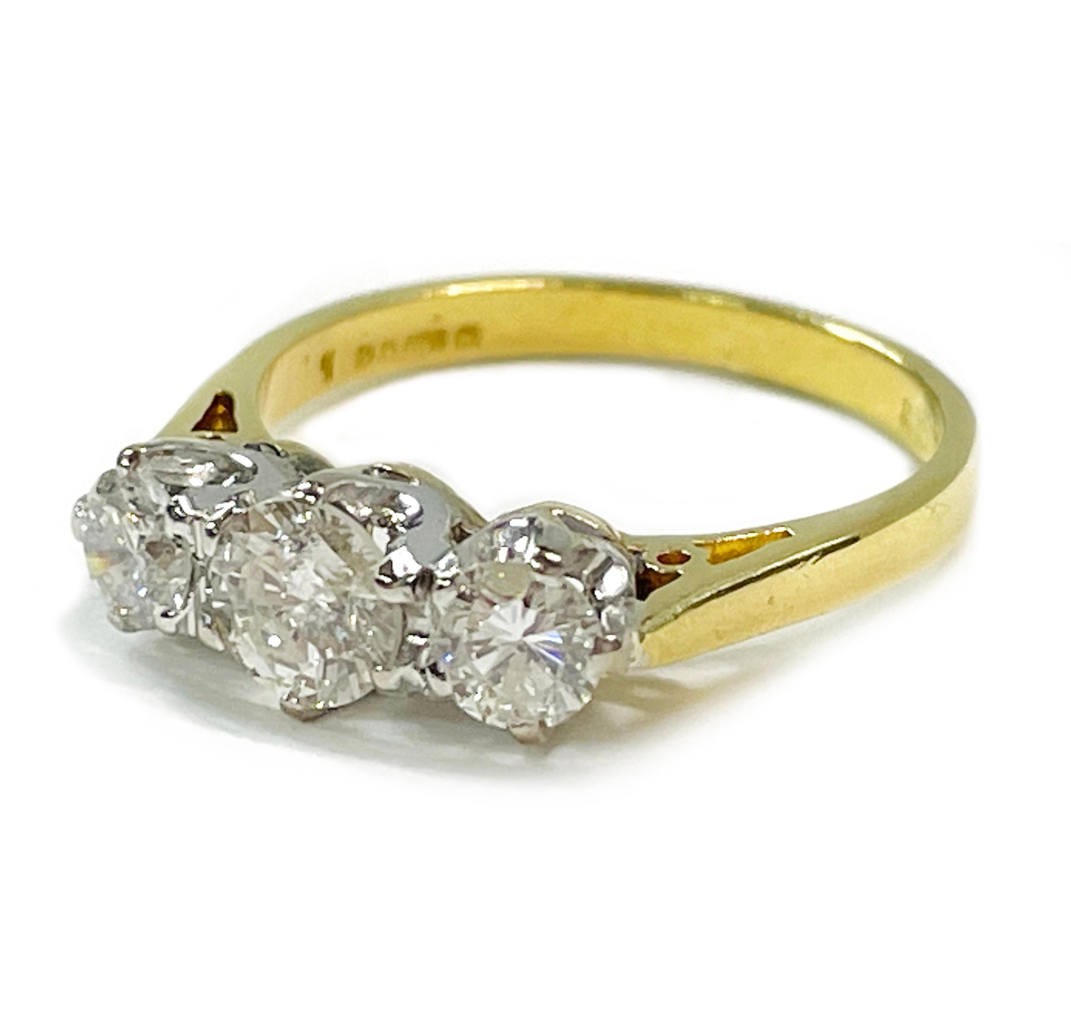 18 Karat Yellow Gold Platinum Three Diamond Antique Ring. Simple and elegant handmade three diamond ring design. All three diamonds are brilliant-cut and five prong-set in platinum. The center diamond is larger measuring 5.2mm, while the side