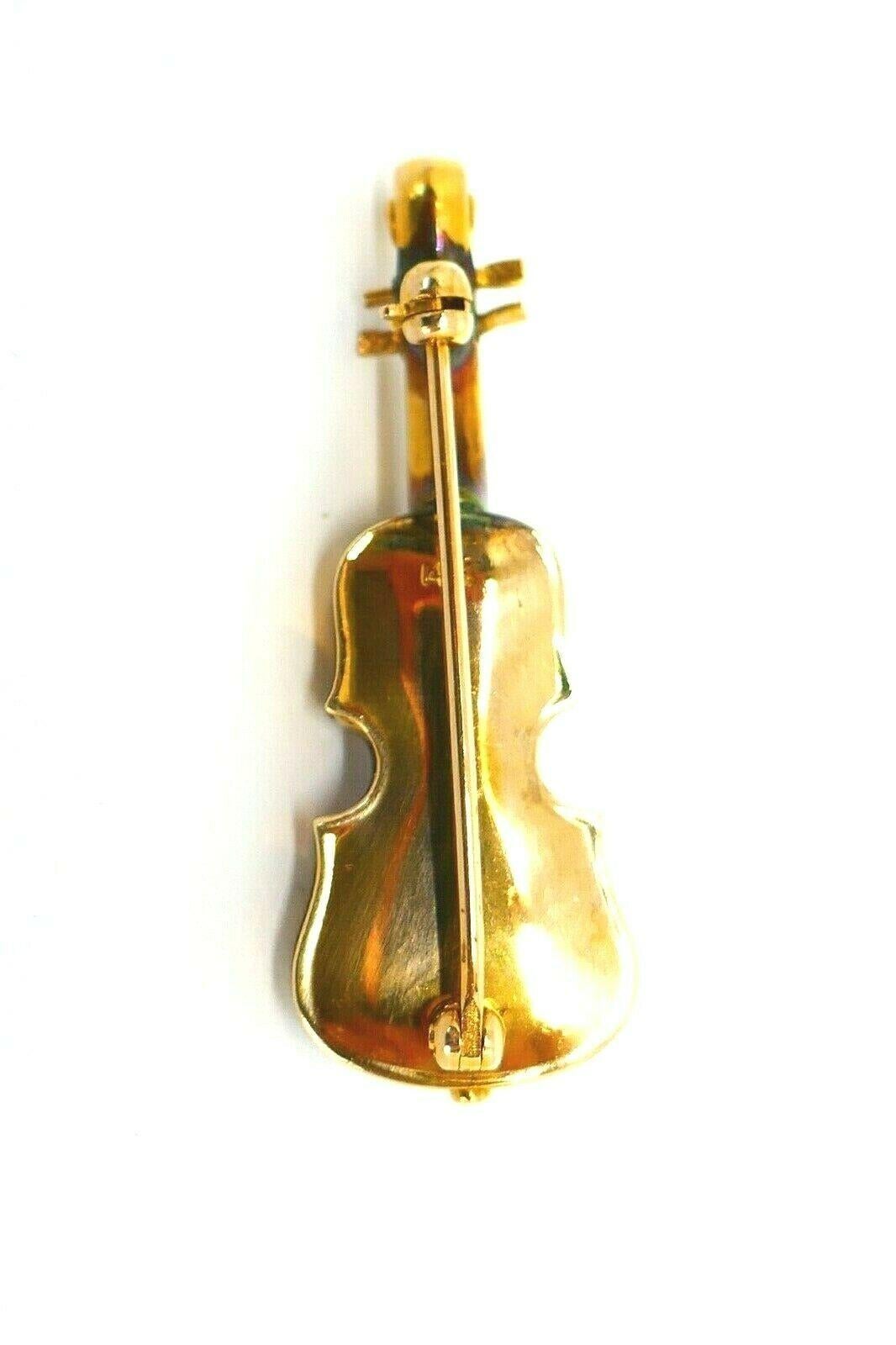 Adorable antique 14k yellow gold enamel violin pin brooch. 
Stamped with a hallmark for 14k gold. 
Measurements: 1 3/8