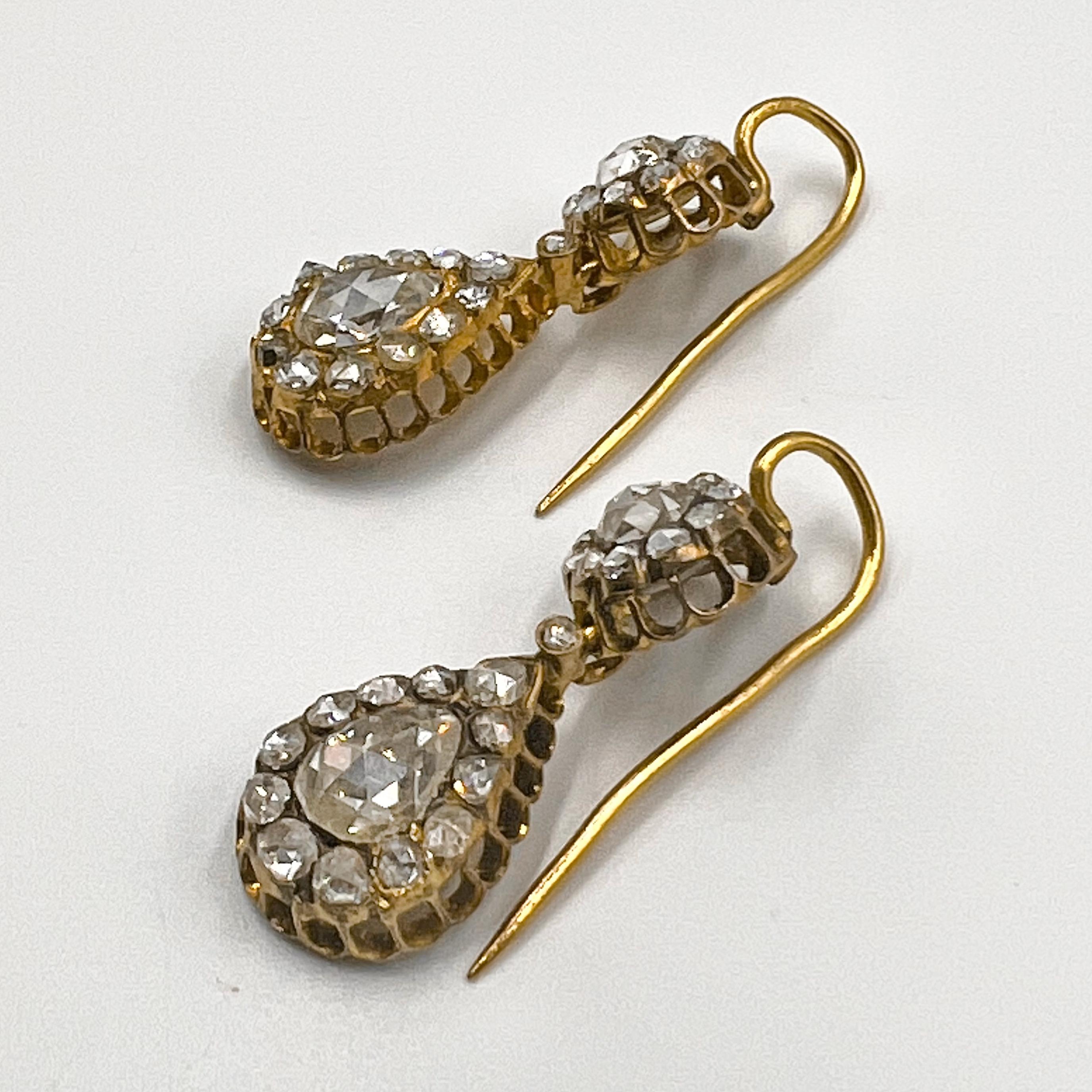 Antique double-drop diamond cluster earrings, featuring cushion, round and pear-shaped rose-cut diamonds weighing approximately 6.00 total carats.  Solid gold backing.  Gold pierced wires.  Measuring 1.5