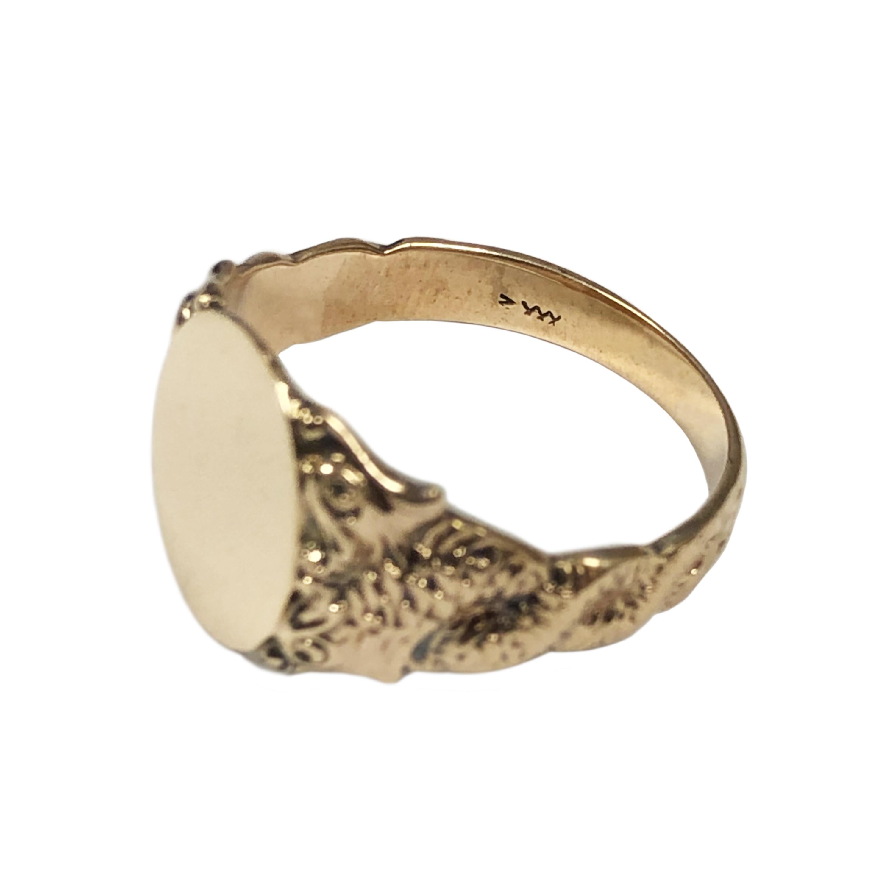 Circa 1910 14K Yellow Gold Signet Ring, the top measures 9/16 X 7/16 inch, the sides of the ring are heavy chased intertwined serpents with a double head at the top. Finger size 11.  