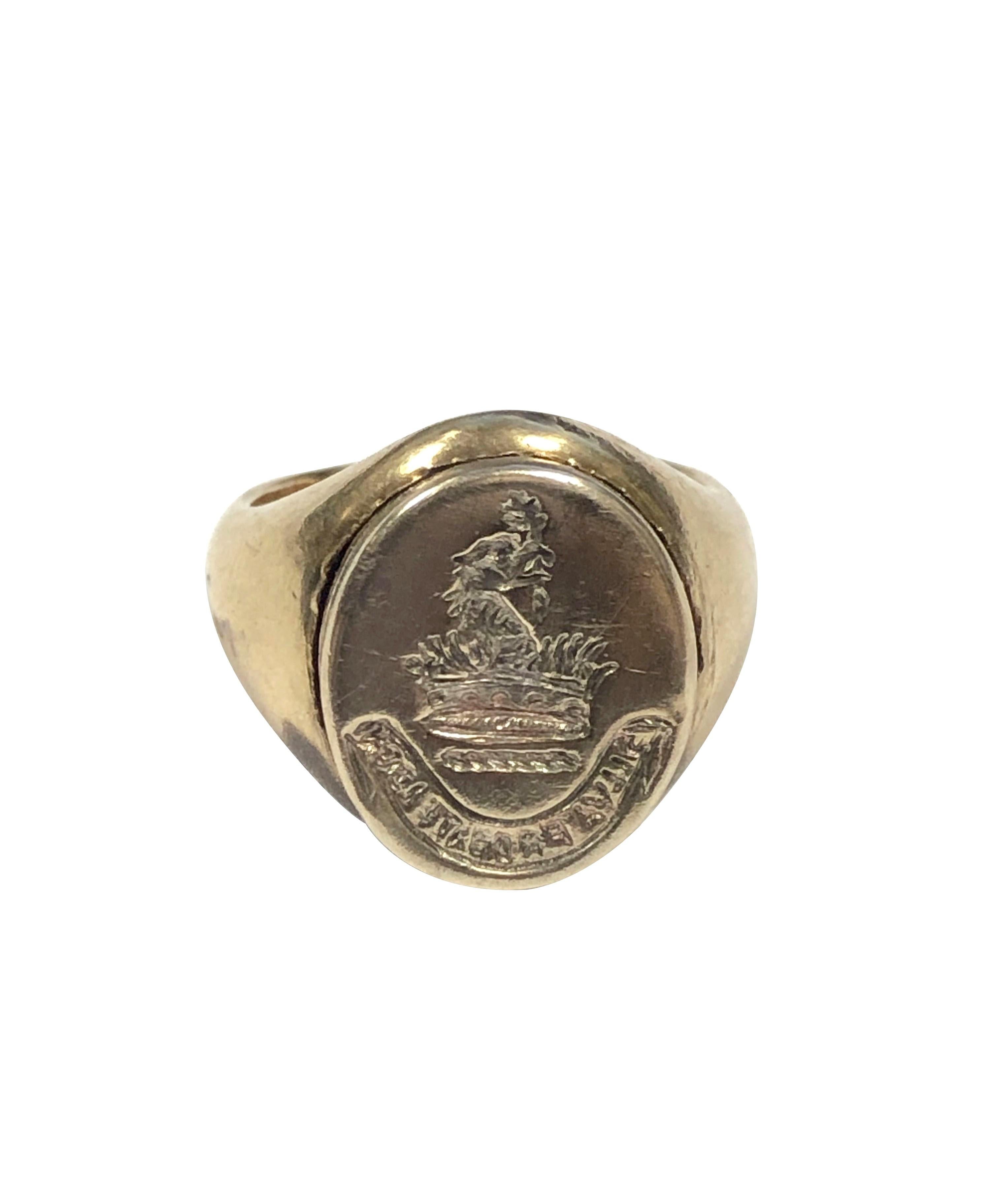 Circa 1910 14k Yellow Gold Signet Ring with hinged top Poison compartment. The top of the ring measures 9/16 X 1/2 inch and has a deep Signet Crest, nice thick solid construction and weighing 8.8 Grams. Finger size 3 1/2 and can be sized up a bit. 