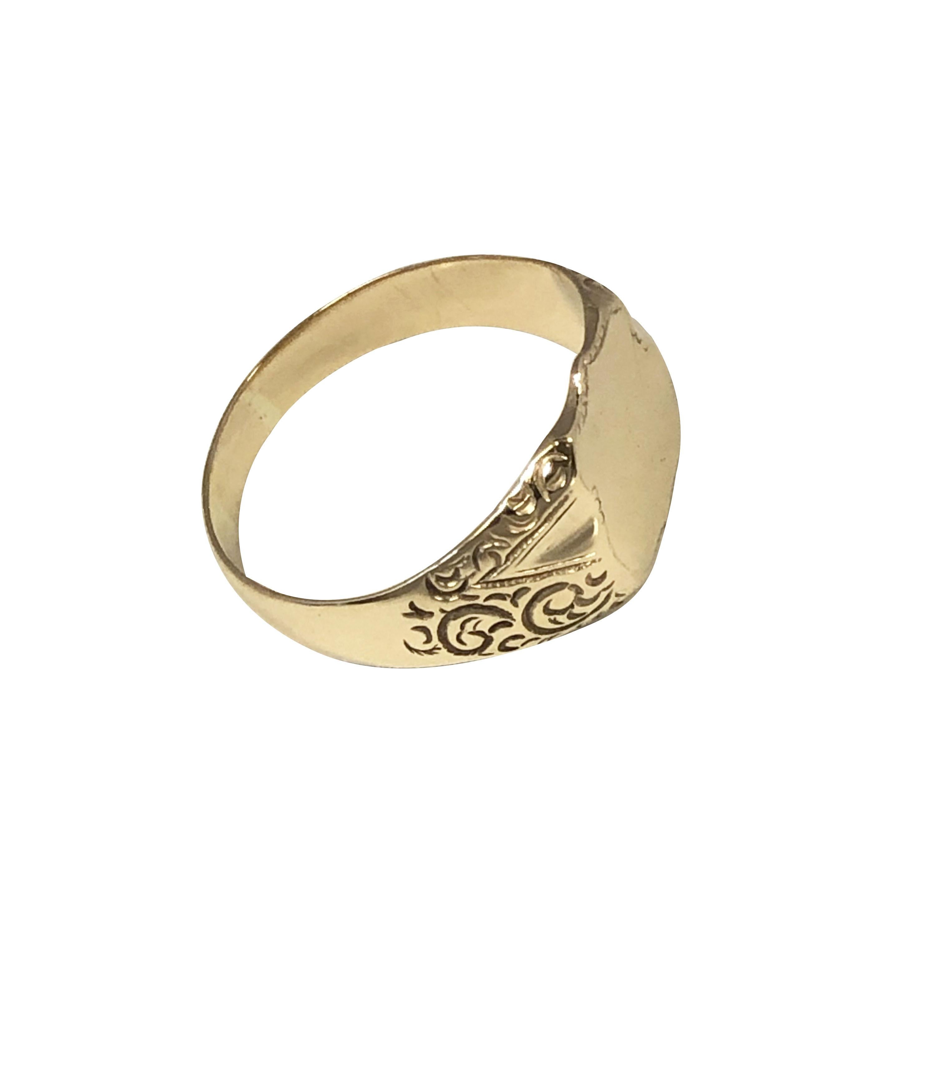 Circa 1900 14K Yellow Gold Signet Ring, the Shield form top measures 1/2 x 1/2 inch, hand chased sides, finger size 10 1/4, weighs 5.5 Grams. 