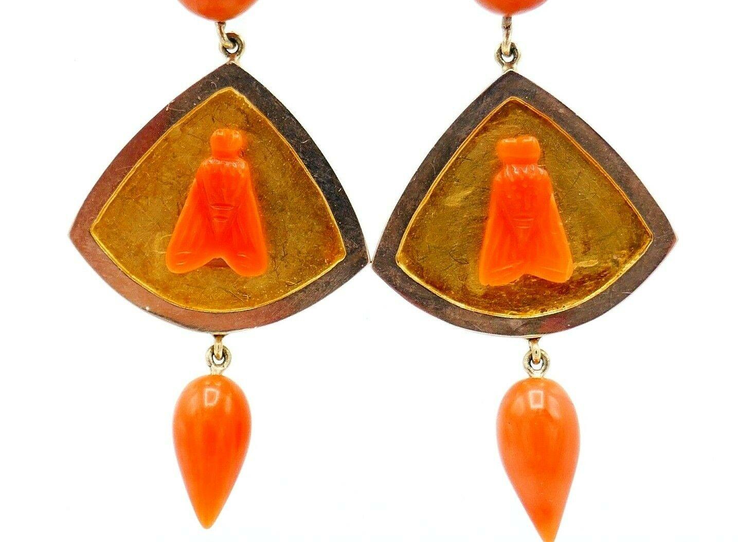 Cute Antique dangling earrings made of 14k yellow and rose gold featuring carved and cabochon coral.  
Measurements: 2 1/8