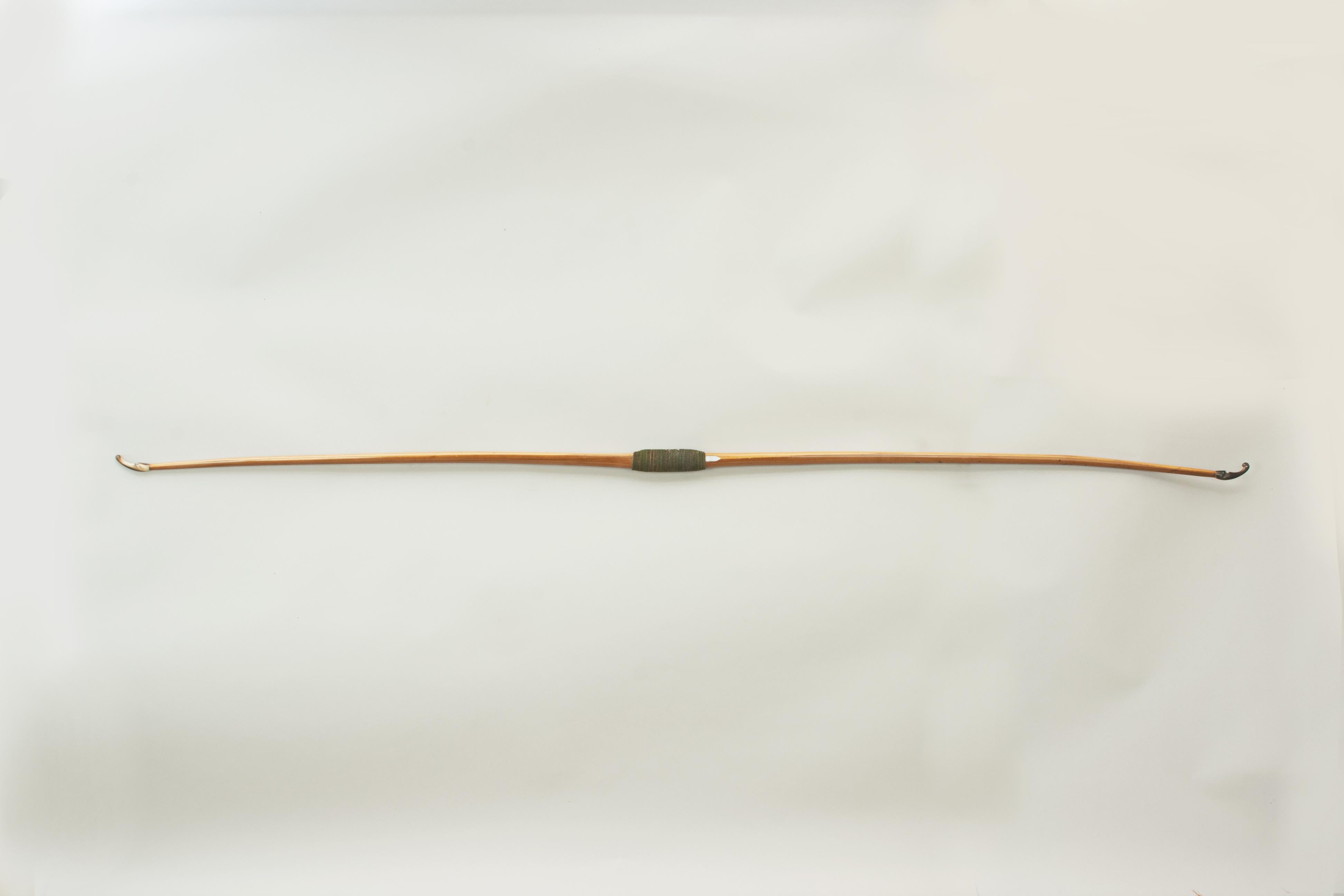 A beautiful ladies yew wood archery long bow by Thomas Aldred.
A very good yew wood archery bow produced by the workshops of Thomas Aldred, London, which operated from 1846-1918. The bow is fitted with horn nocks and a green fabric handle. Just