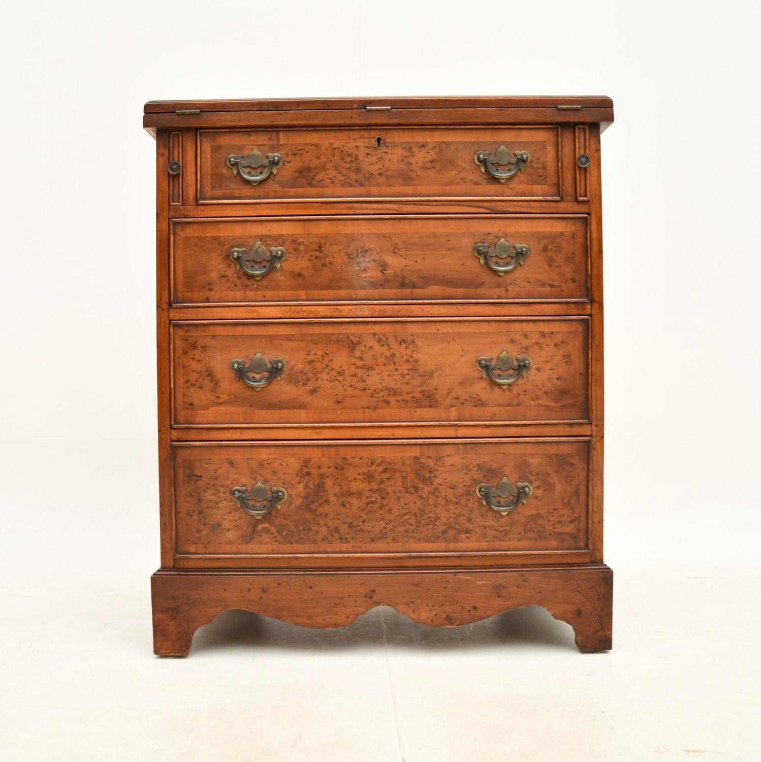A stunning antique yew wood bachelors chest of drawers. This was made in England in the Georgian revival style, it dates from around the 1920’s period.

The quality is outstanding and this has a very useful design. It it fairly small and compact,
