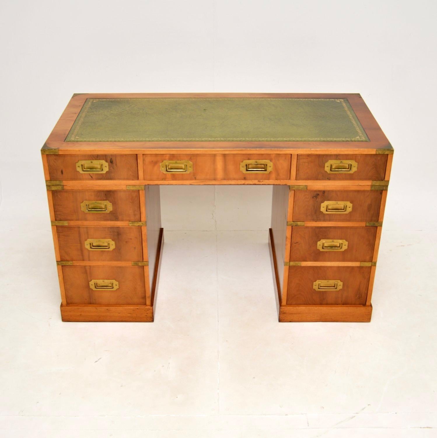 A top quality antique yew wood military campaign style pedestal desk. This was made in England, it dates from around the 1950’s.

It is very well made, with a useful and smart design. The yew wood has a lovely colour tone, there is high quality