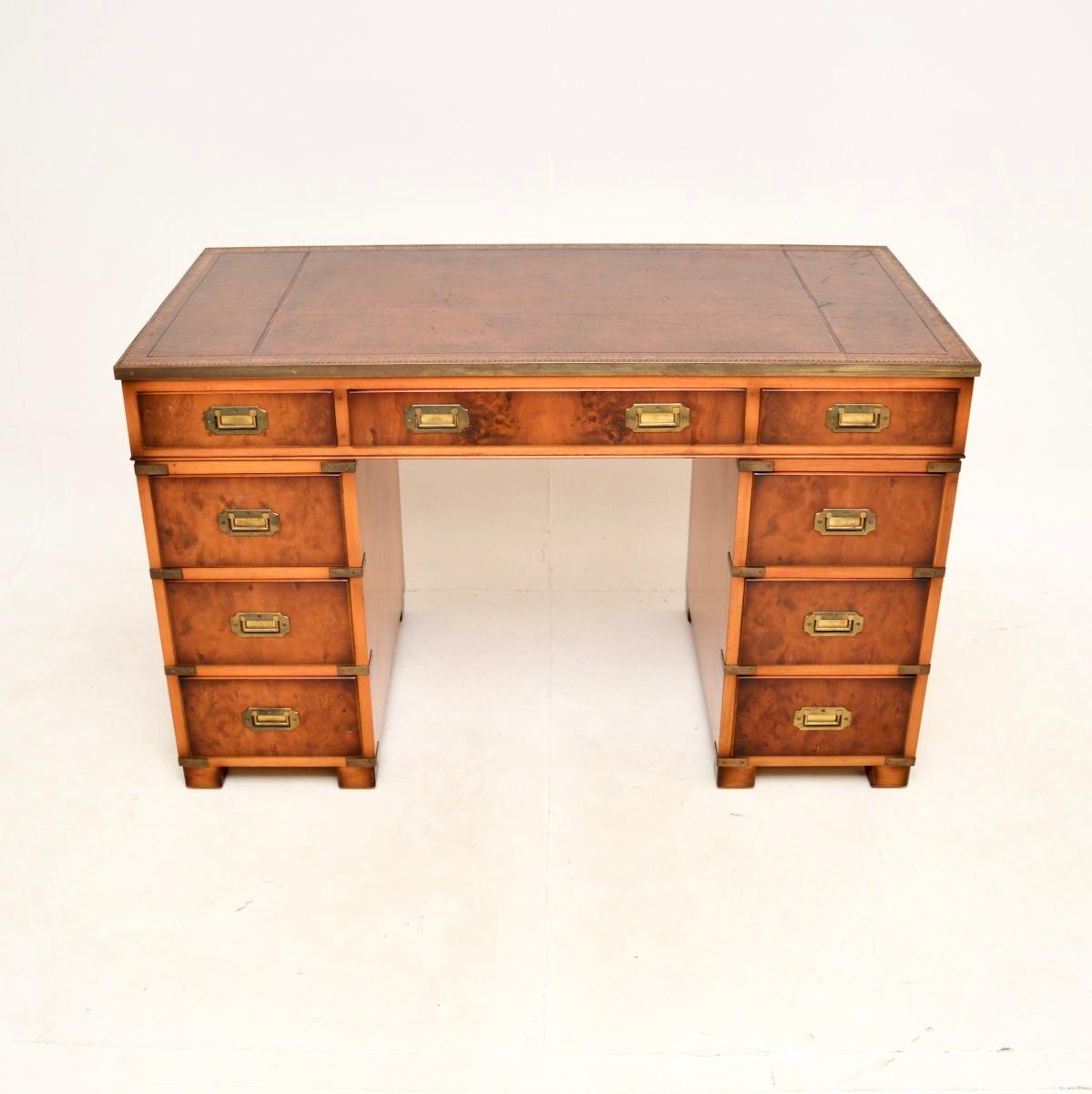 A top quality antique yew wood military campaign style pedestal desk. This was made in England, it dates from around the 1950’s.

It is very well made, with a useful and smart design. The yew wood has a lovely colour tone, there is high quality