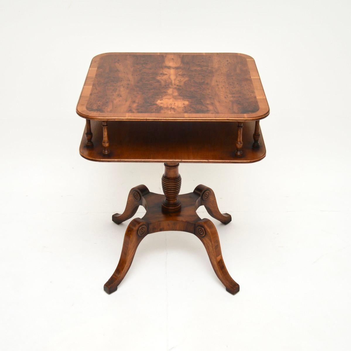 A beautiful and very well made antique yew wood occasional side table. It is in the Regency style, this was made in England, and dates from around the 1930’s.

It is of superb quality, the square top has rounded edges and a useful lower tier,