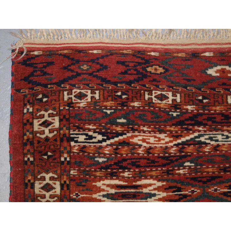 Antique Yomut Turkmen 'dip khali' rug of scarce banded design. The rug has an excellent soft colour palette.

The rug is well drawn with bands of varying design, the border is typical for Yomut rugs.

The rug is in excellent condition with slight