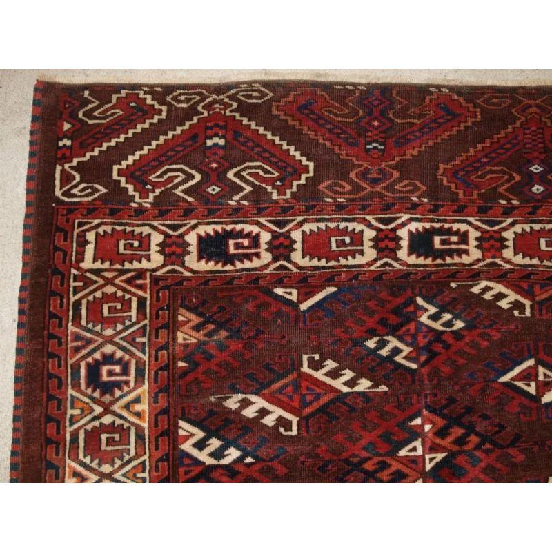 The carpet has a rich brown ground colour with some very nice blues, greens, ivory and reds. The carpet has a well drawn curl leaf border and eagle design elem panels at both ends.

The carpet is in excellent condition with even wear and medium