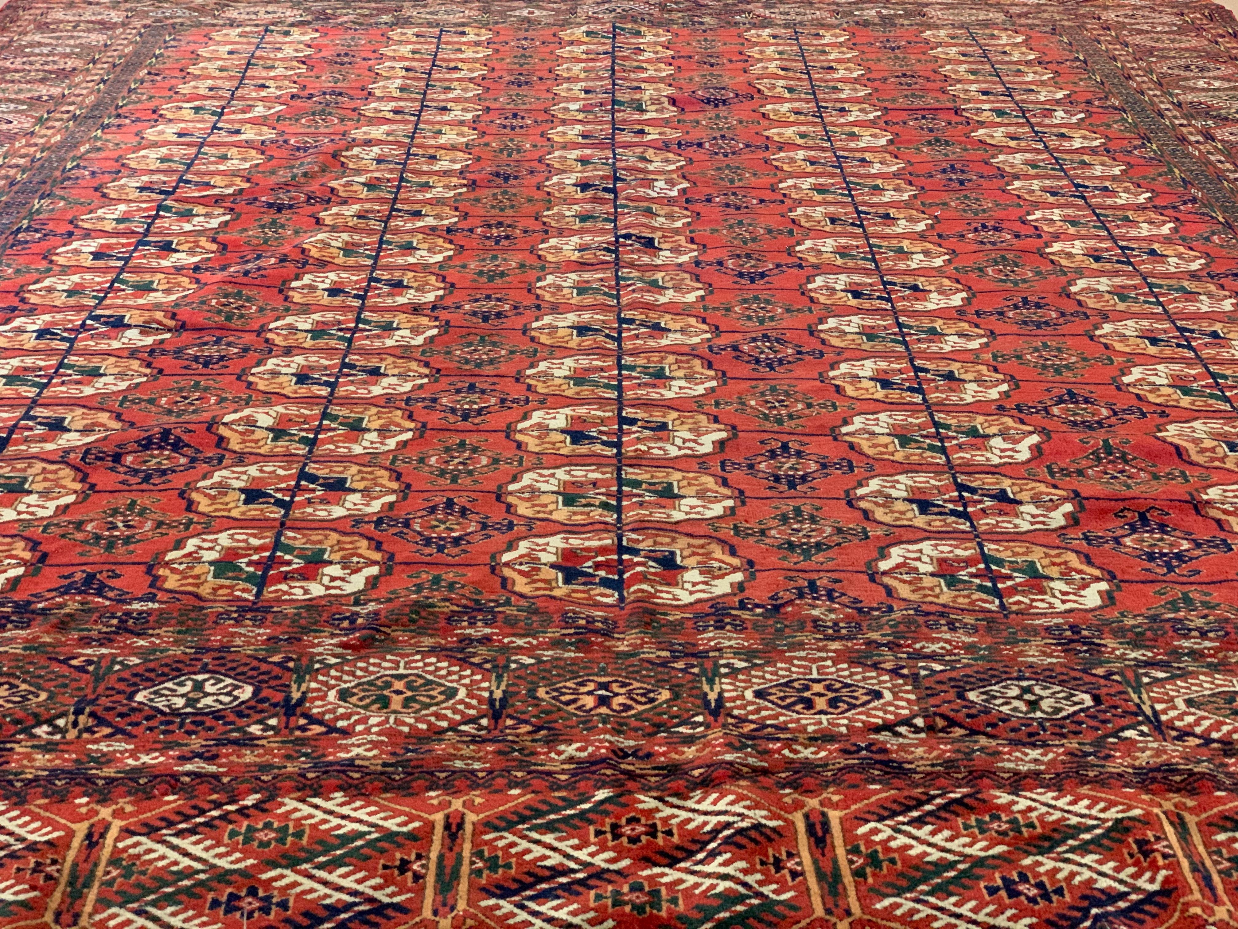 This is an antique hand-knotted rug, made by the Yomut (Yomoud) Turkmen in Turkmenistan, circa 1880. It is wool knot on wool warp and weft and is approximately 8.5 x 11 ft, with all natural vegetable dyes, made before the invention of modern