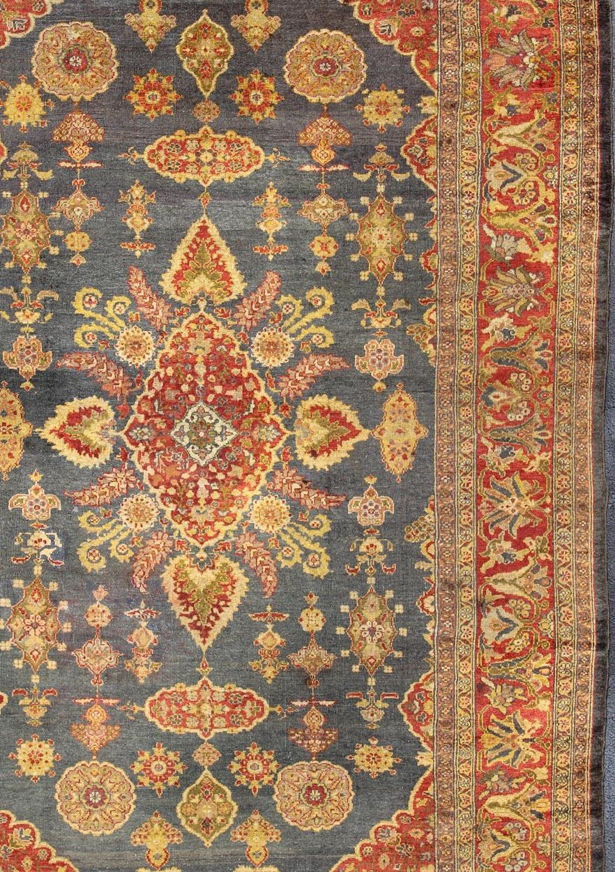 Large Antique Zeigler Sultanabad Rug with Elegant Medallion Design in Blue & Rust Red. Antique Persian Zeigler Sultanabad Rug. Keivan Woven Arts / rug /19-0813  country of origin / type: Iran / Traditional Design, Classic Design
Measures: 10'3 x