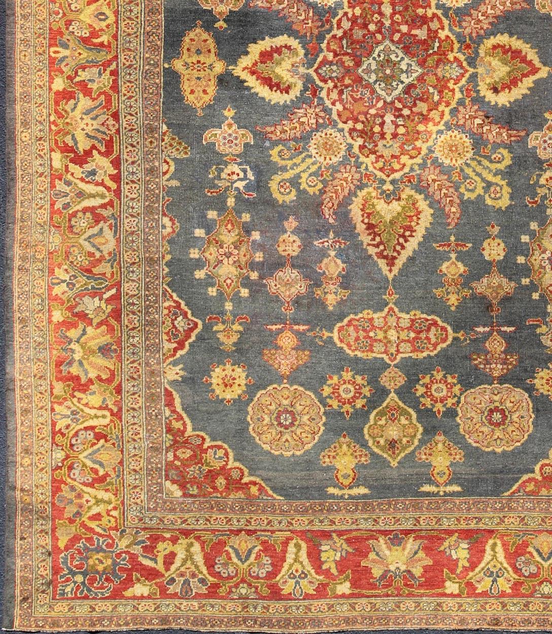 Persian Antique Zeigler Sultanabad Rug with Elegant Medallion Design in Blue & Rust Red For Sale