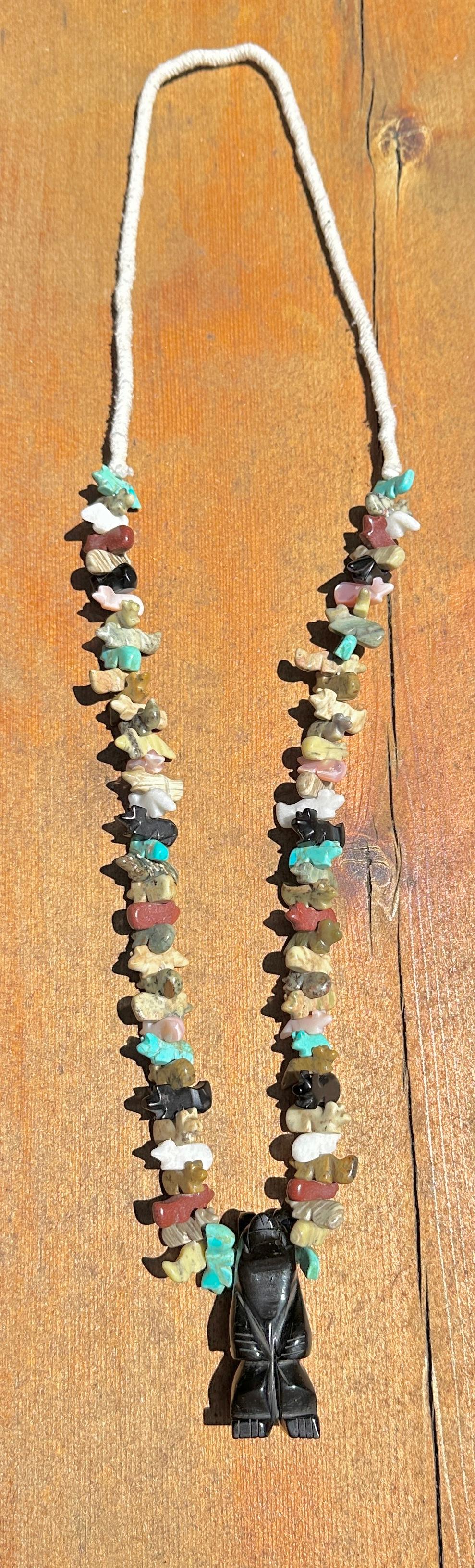 THIS IS A MAGNIFICENT ANTIQUE NATIVE AMERICAN INDIAN ZUNI SLEEPING BEAUTY TURQUOISE, JET, AGATE, PIPESTONE, MOTHER OF PEARL BEAR, ANIMAL FETISH NECKLACE WITH 77 SMALL FETISH ANIMALS AND A WONDERFUL LARGE BLACK JET BEAR IN THE NAJA CENTER!
The