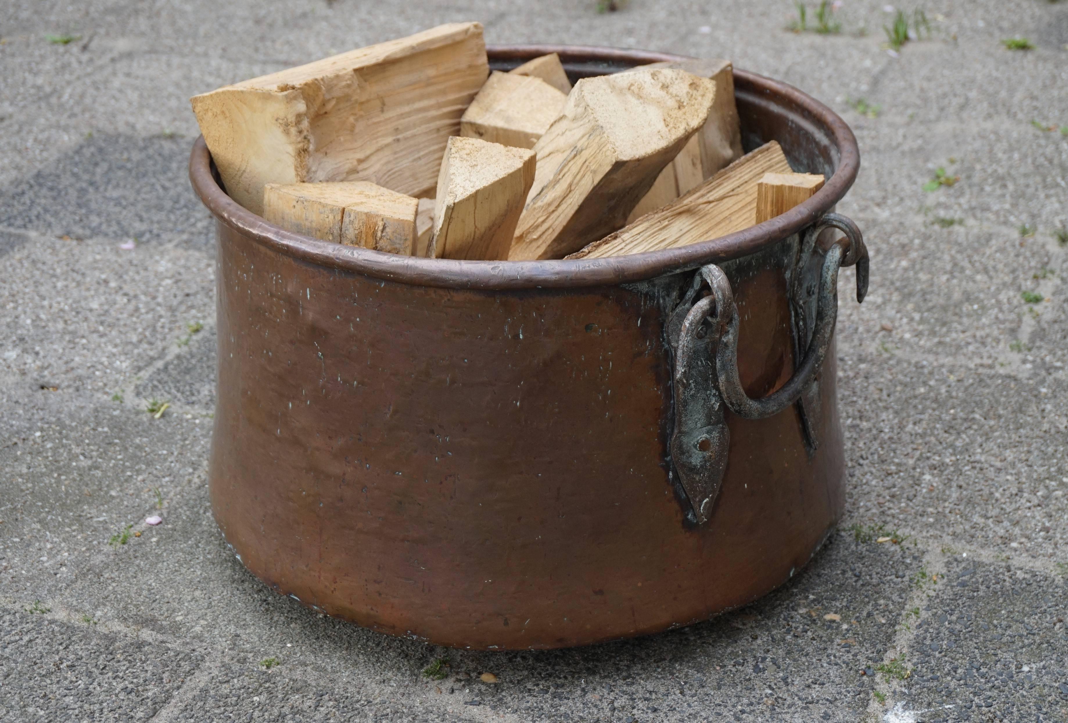 Early 1800s and highly stylish bucket.

Only if you were a very wealthy person in Holland in the early 1800s, would you be able to afford such a large, impressive and all-handcrafted bucket. This stunning and tactile antique would be placed on or