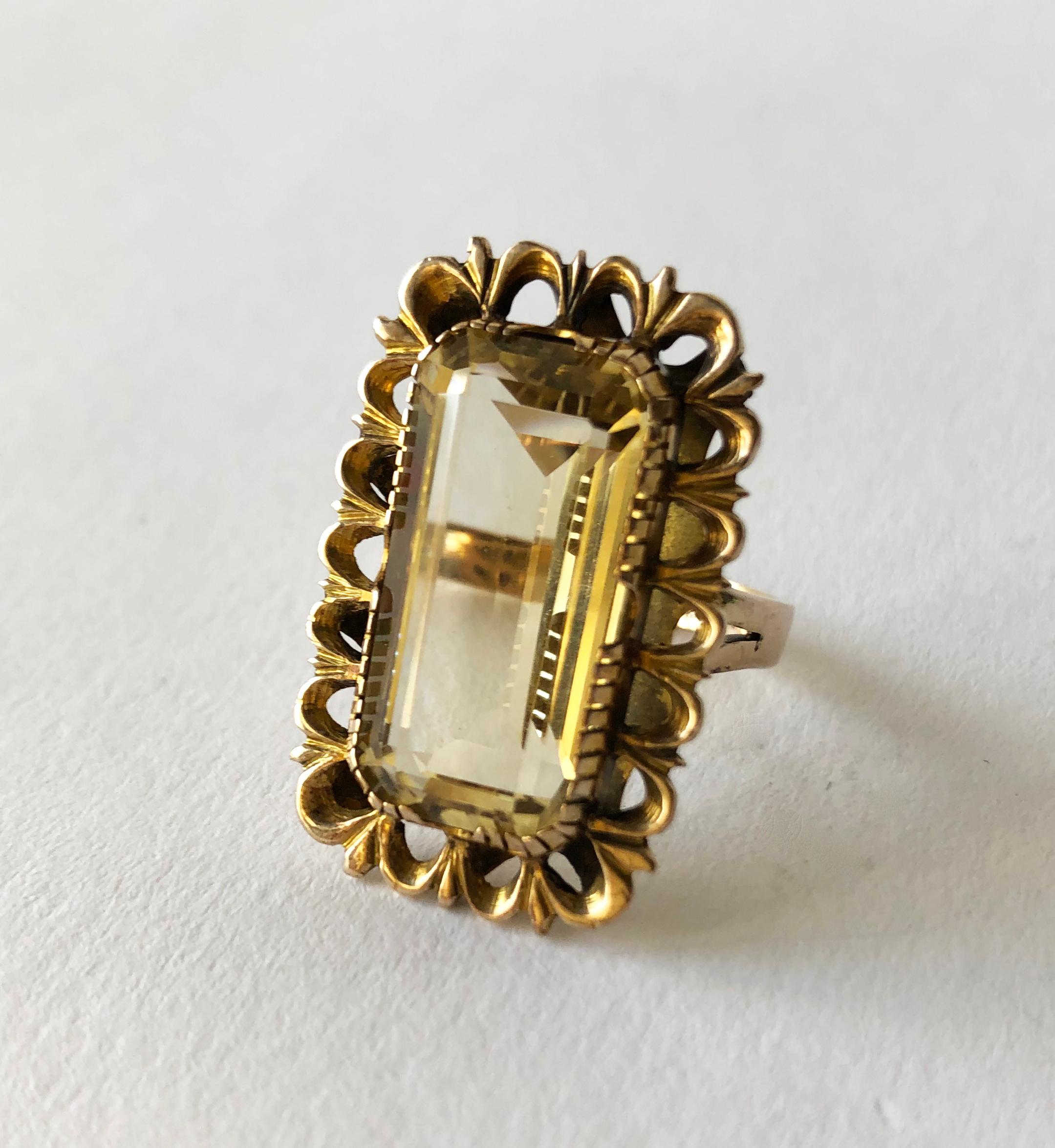 Antiqued 14k gold ring with large faceted citrine, circa 1960s.  Ring is a finger size 7 to 7.25 and is signed 14k.  In very good vintage condition. 8.8 grams.