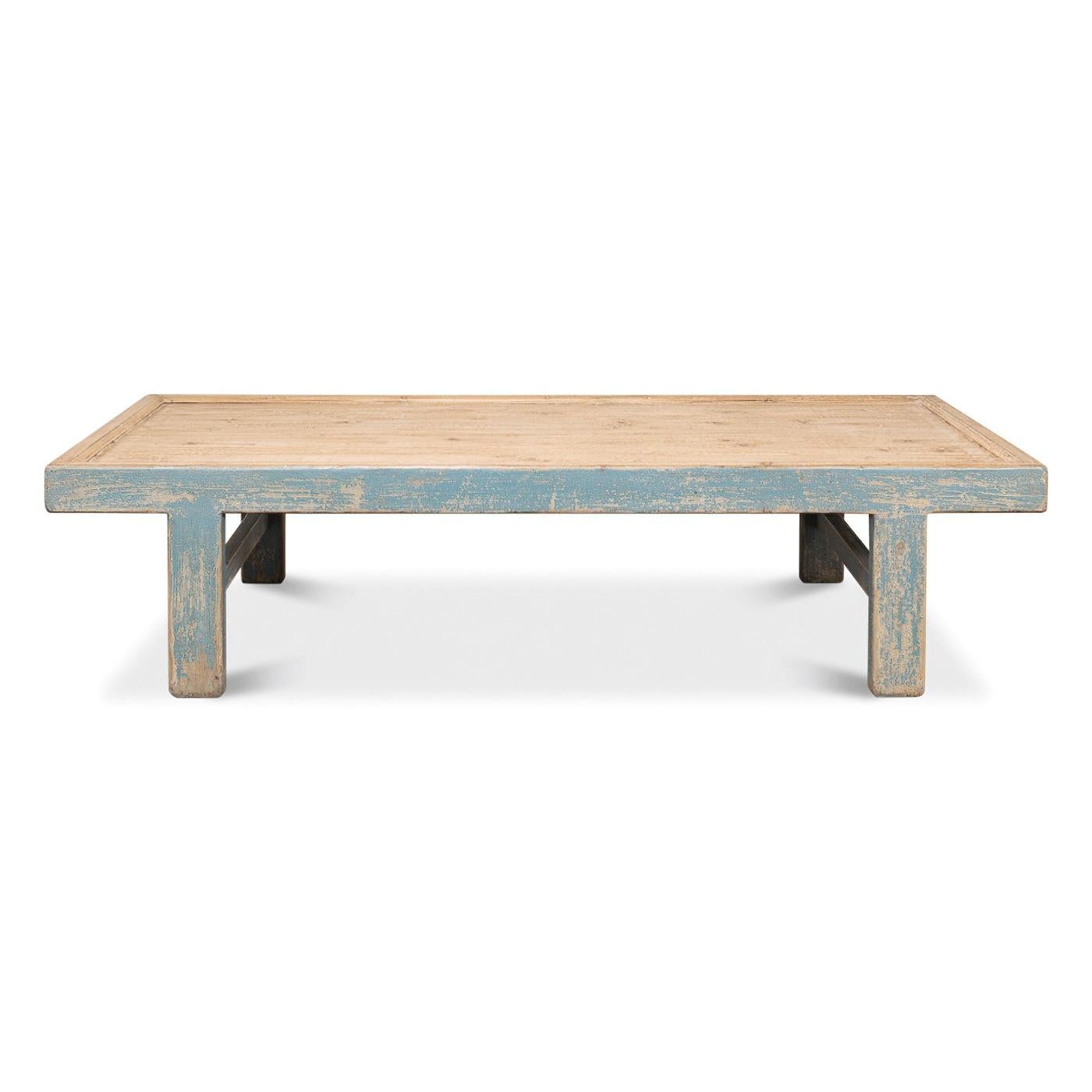 An antiqued blue rustic-style coffee table with a distressed finish. This beautiful coffee table with its distressed finish is full of rustic charm. Clean lines and a large tabletop make it the perfect coffee table to complete your living