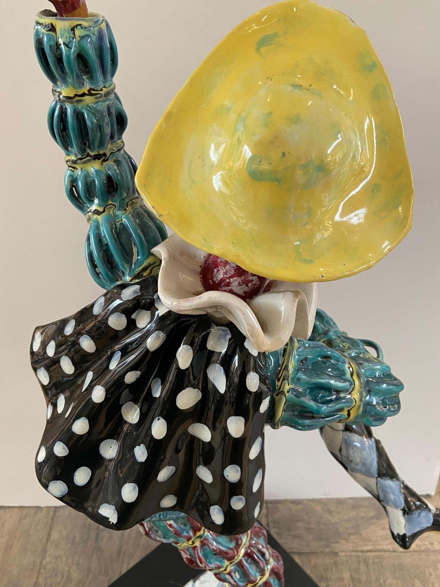 This is a one of kind porcelain glazed figure of a Mask Jester made by Famous Venetian sculptor Eugino Pattarino or Otello Rosa for San Polo Venezia, great color on a wood base.