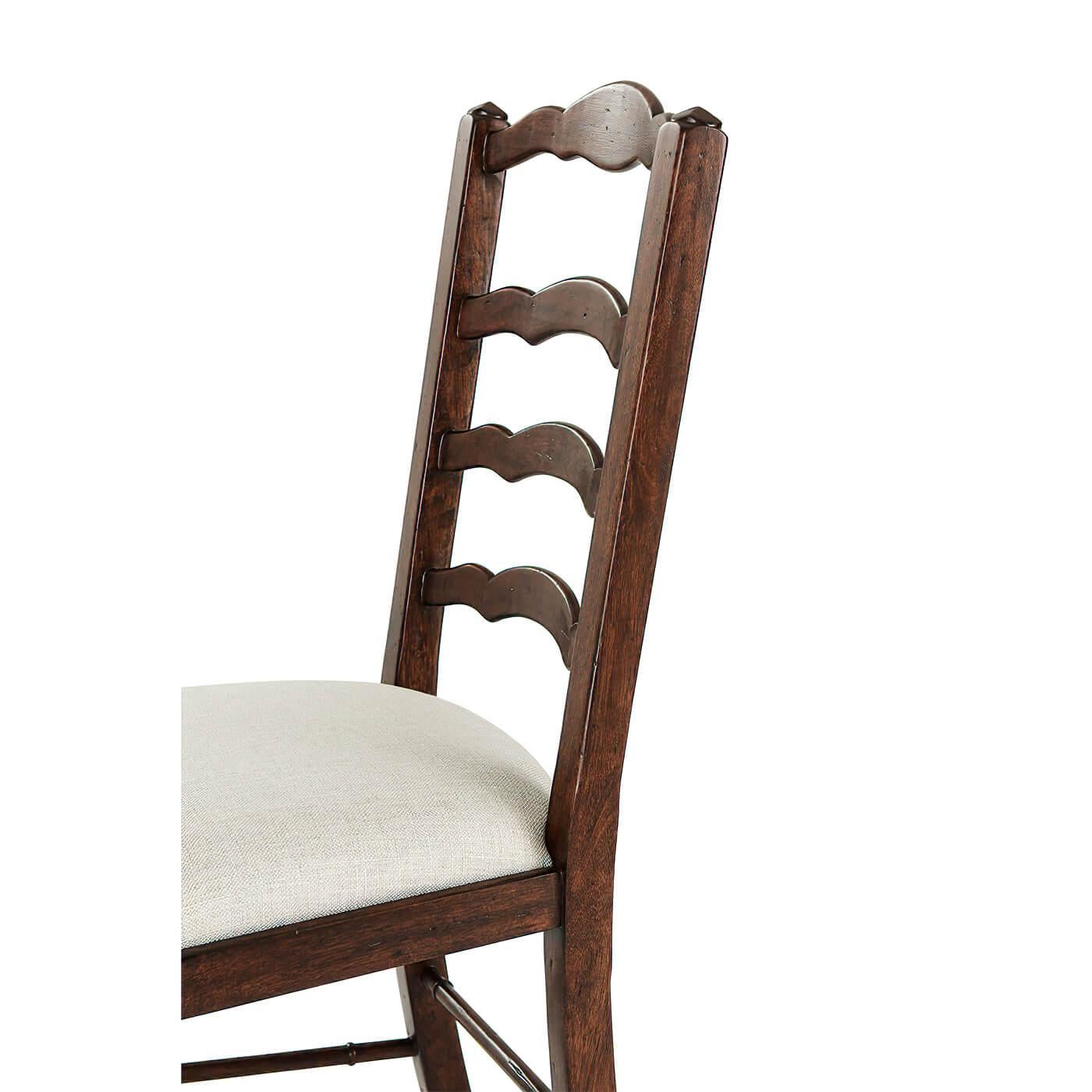 An English country-style antiqued wood dining side chair, the arched serpentine ladder back above an upholstered drop-in seat, on sabre legs joined by undulating stretchers.

Dimensions: 20