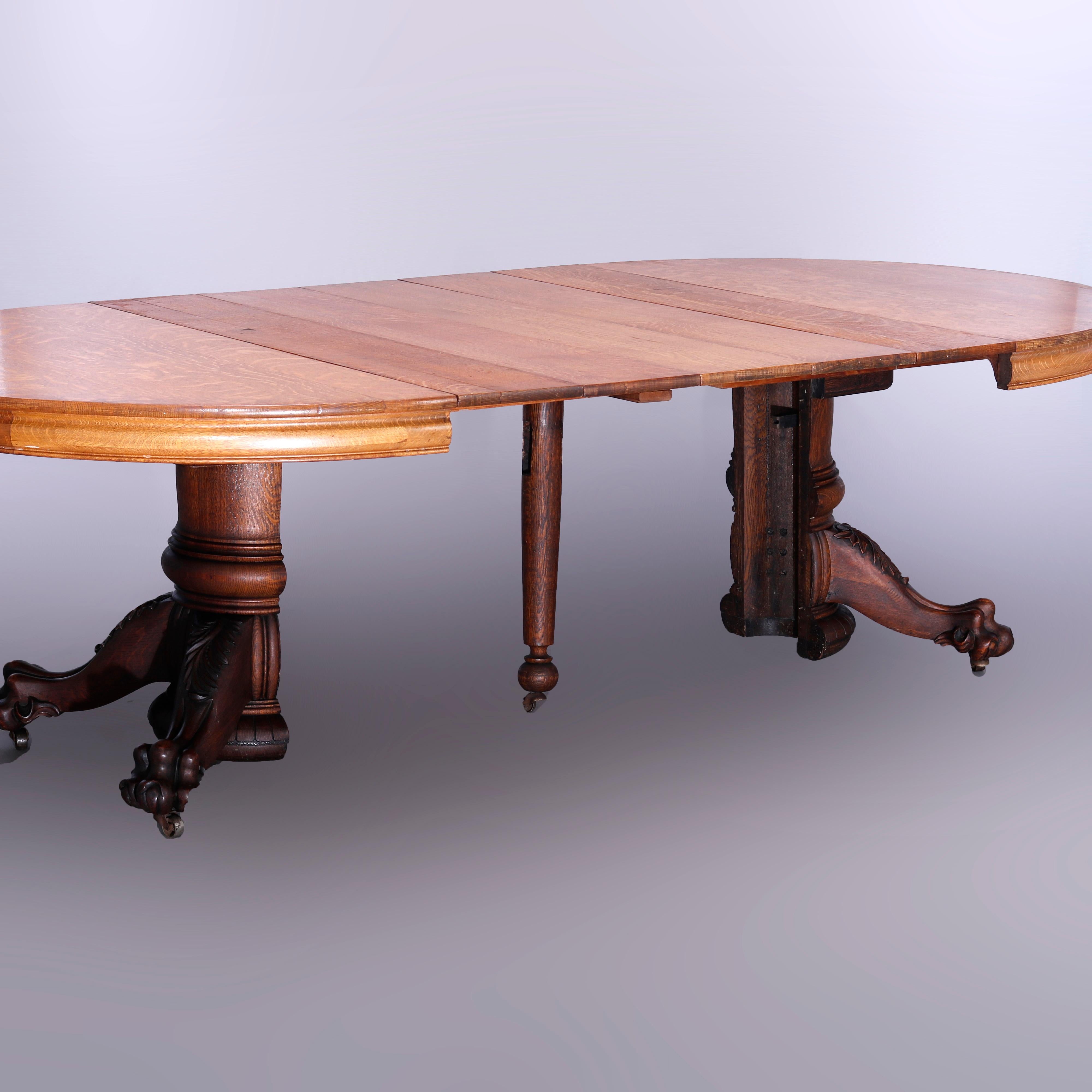 Américain AntiqueHastings Table de salle à manger de style banquet en chêne rond sculpté à pieds griffes et 5 feuilles, vers 1910