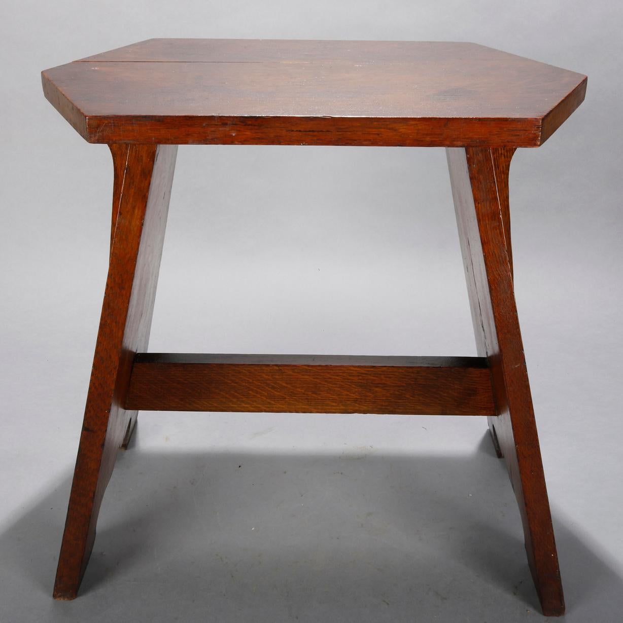 An antiques Arts & Crafts Mission cricket bench in the manner of Limbert offers oak construction with elongated stylized diamond seat surmounting flared legs, circa 1910.

Measures: 18.25