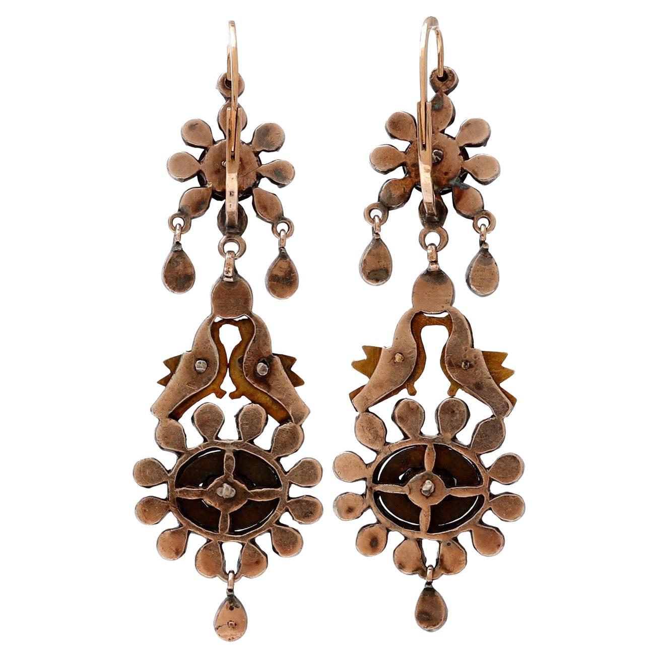 Magnificent Antiques Earrings in Gold 14 Karats and views in silver old European center 18th Century with Diamonds rose cut 0.40 carats. It has motifs of two birds facing 19.50 grams.
Length 6.5 centimeters.

