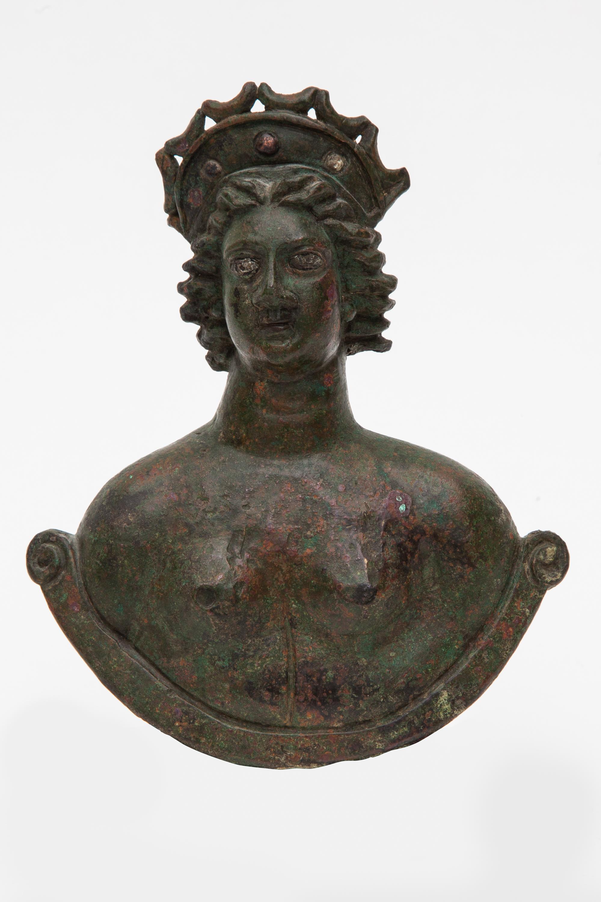 Large bust weight of Venus with silver inlaid eyes and celestial diadem,Roman culture,Germany,2nd-3rd century AD.
The goddess is depicted nude, slightly gazing to her right with detailed silver inlaid eyes and firmly expressed lips. Her hair is