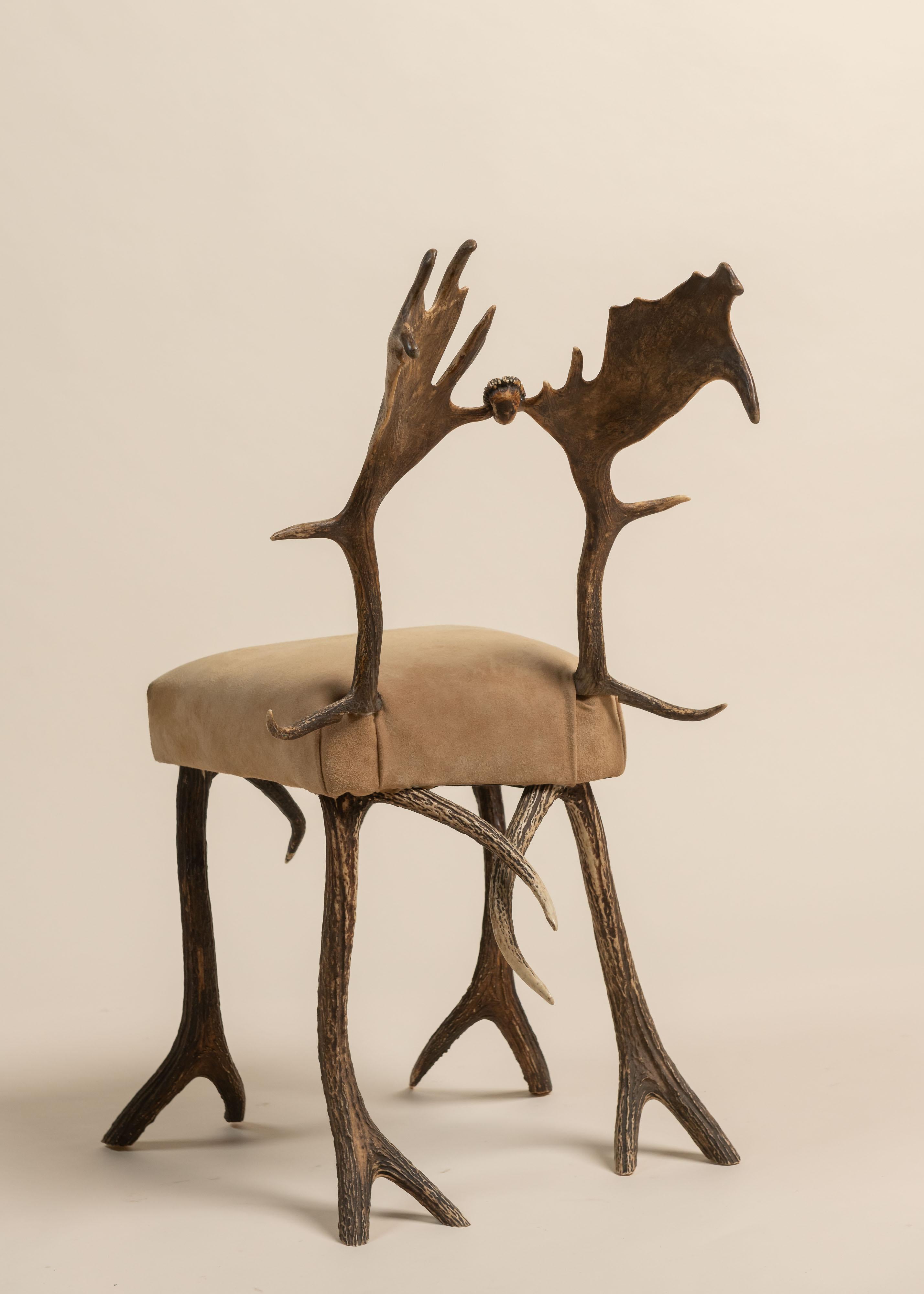 Side Chair made of Antlers and Fallow Antlers, upholstered in a rich tan suede. Great addition to any room as art, especially, in a wonderful cabin or chic study.