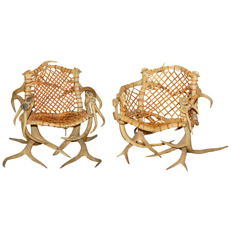 Antler armchairs with leather strappings For Sale