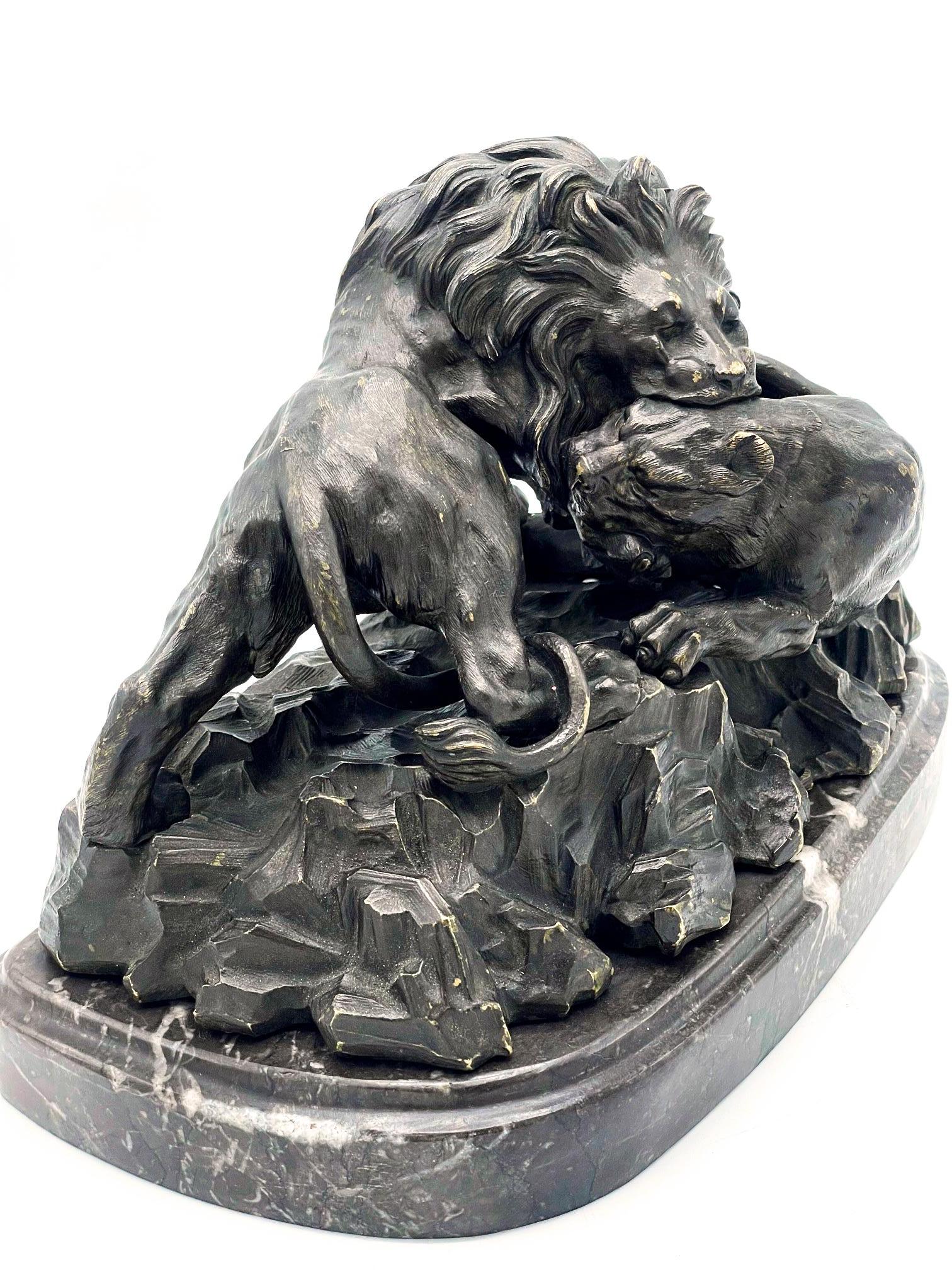 Carved Antoine-Louis Barye (1795 - 1875) bronze, LLion crushing a on oval base, signed For Sale