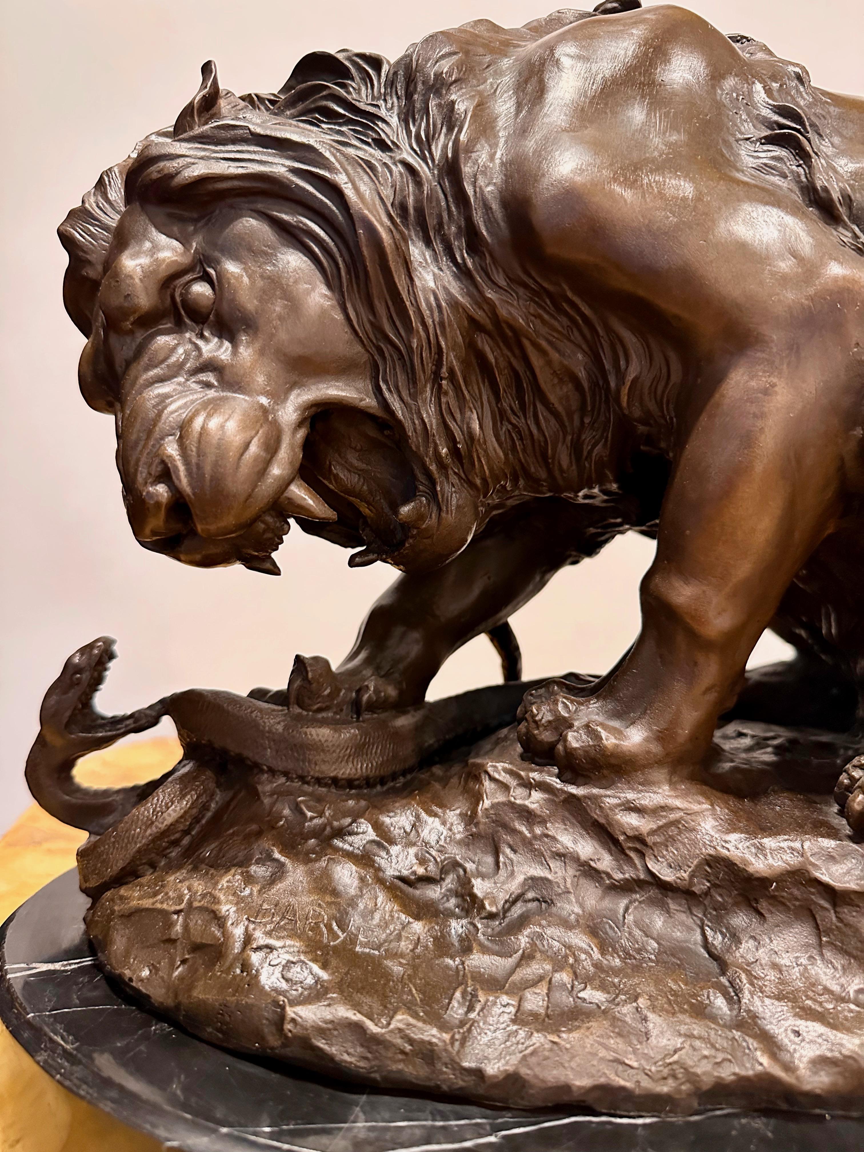 Antoine-Louis Barye (Paris, 1795-1875). Lion crushing a Snake. Bronze with a brown patina signed Barye on the left hand side of the base. The bronze sculpture is sitting on a black marble base.

This spectacular bronze representing the 