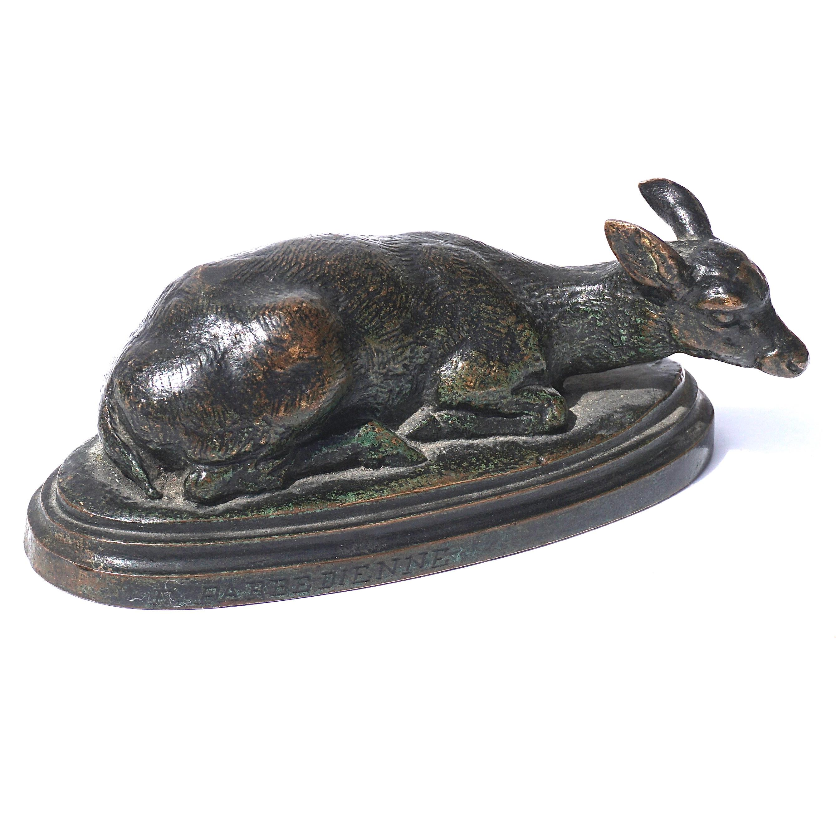 Antoine Louis Barye Reclining Doe bronze with green and brown patina cast by F. Barbedienne circa 1880. Signed “BARYE” and :F. BARBEDIENNE”. Underside with brace marked “B” and numbers 1195.

Measures: Width 3.5 Inches, height 1.5 inches, depth 1.7