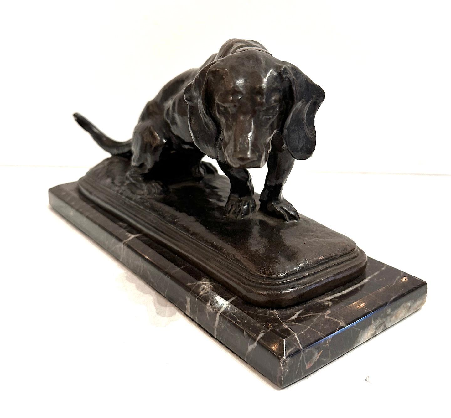 A bronze hound sculpture on marble based.  
Signed by French animalier sculptor Antoine-Louis Barye 1795-1875.

