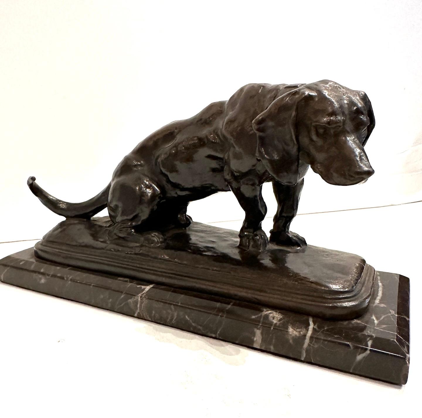 A bronze hound sculpture on marble based.  
Signed by French animalier sculptor Antoine-Louis Barye 1795-1875.
