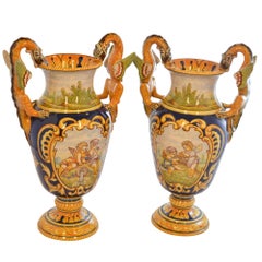 Antoine Montagnon Rouen Vases Hand Painted Cherub Scene and Dragon Handles Pair