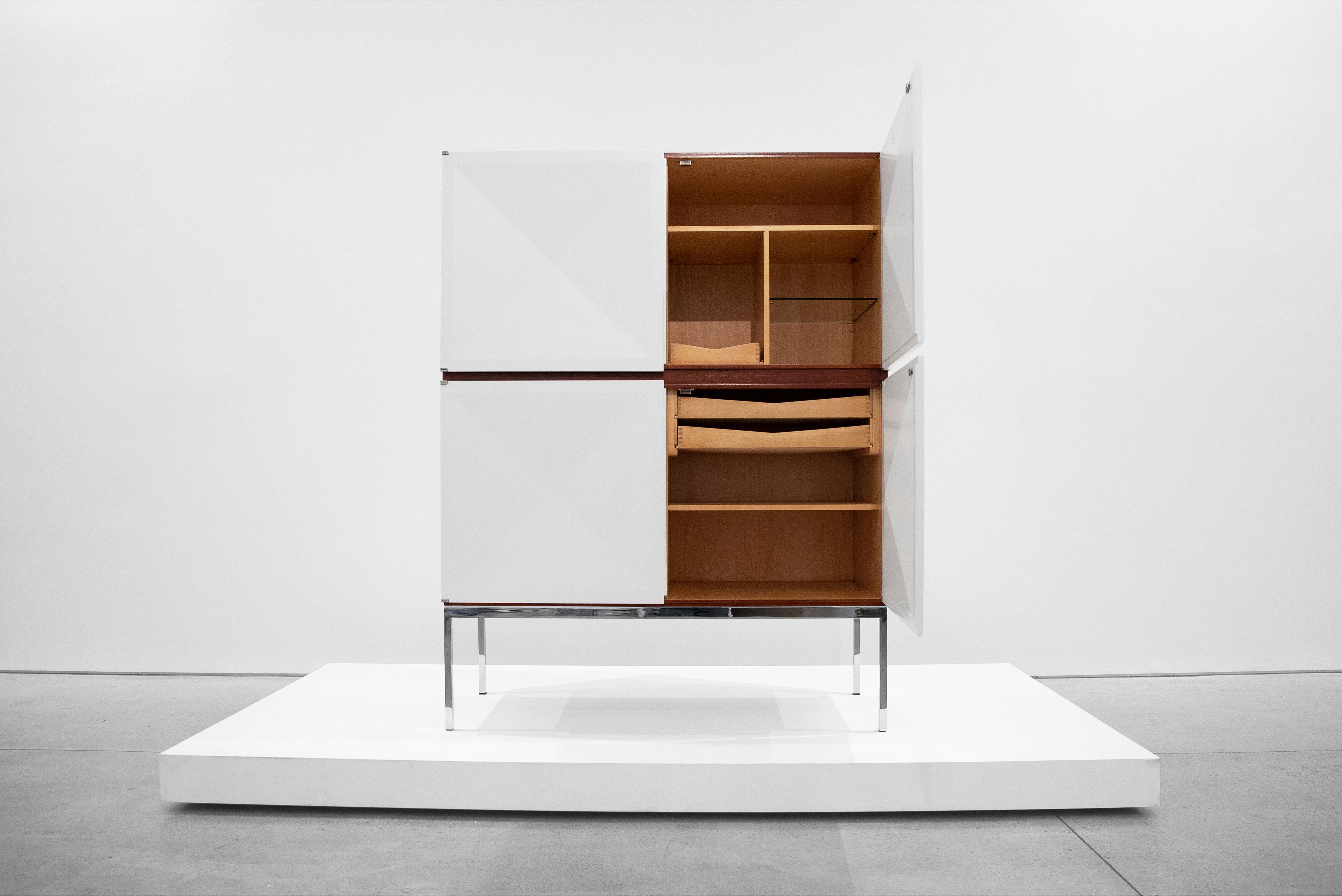 Antoine Philippon & Jacqueline Lecoq, Cabinet, 1307 Series, Edition Erwin Behr, circa 1962, mahogany, chrome-plated steel, Measures: 62 H x 47.25 W x 21 D inches.

This cabinet was designed in 1962 by Antoine Philippon and Jacqueline Lecoq on the