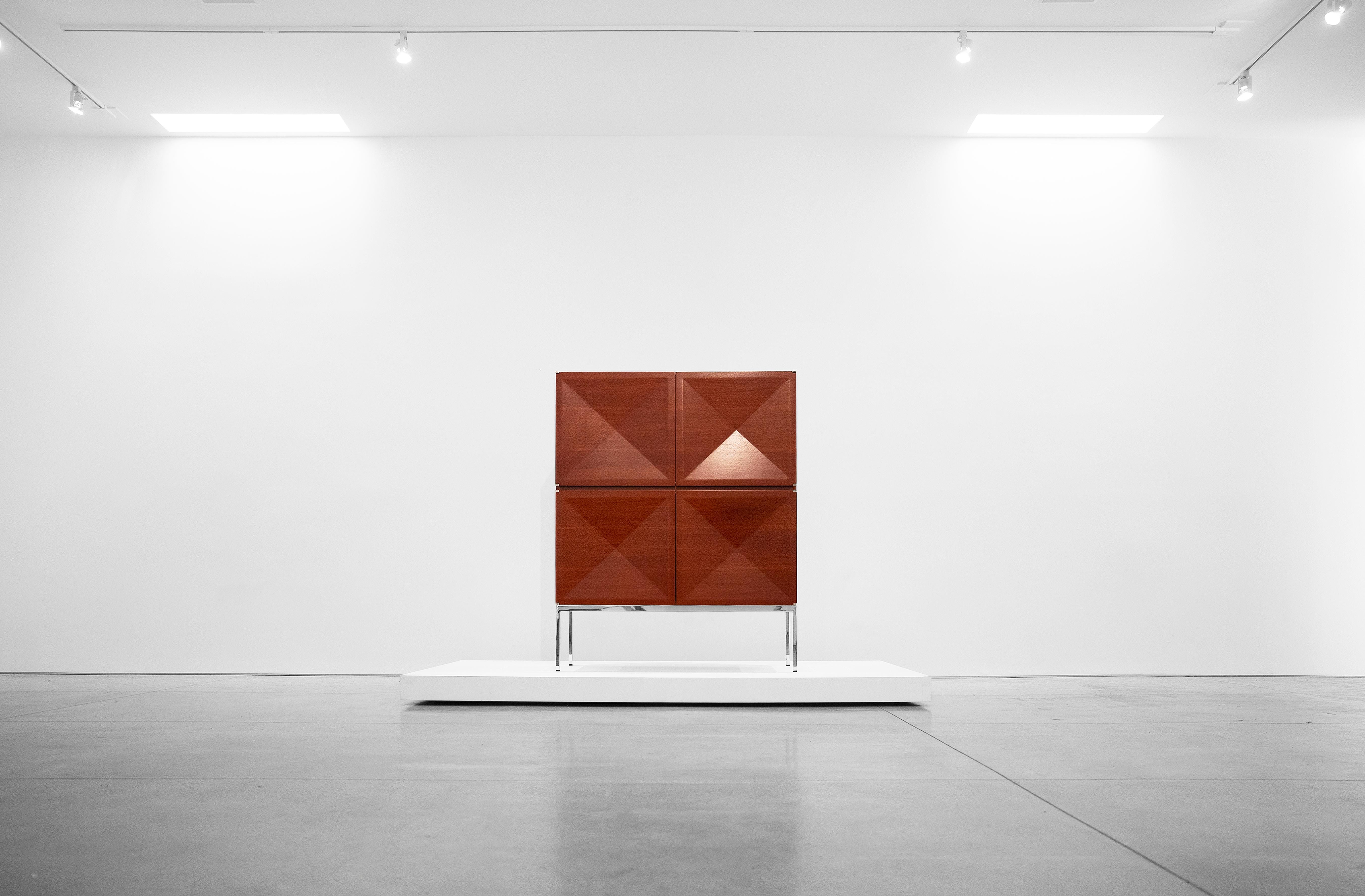 Antoine Philippon & Jacqueline Lecoq, Cabinet, 1307 series, edition Erwin Behr, circa 1962, mahogany, chrome-plated steel, Measures: 62 H x 47.25 W x 21 D inches.

This cabinet was designed in 1962 by Antoine Philippon and Jacqueline Lecoq on the