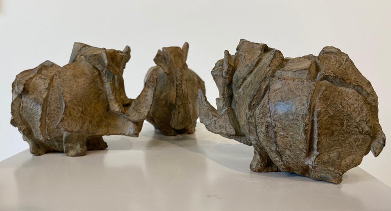 Conclave- 21st century Bronze sculpture of three Rino's together - Sculpture by Antoinette Briet