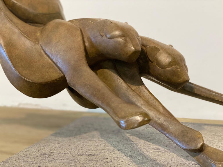 This Sculpture is made by Dutch artist Antoinette Briet. Her forms always are an abstraction of movement in the world of animals. In this particular sculpture she shows here admiration to freedom, the power and the way of moving cheetah's perform.