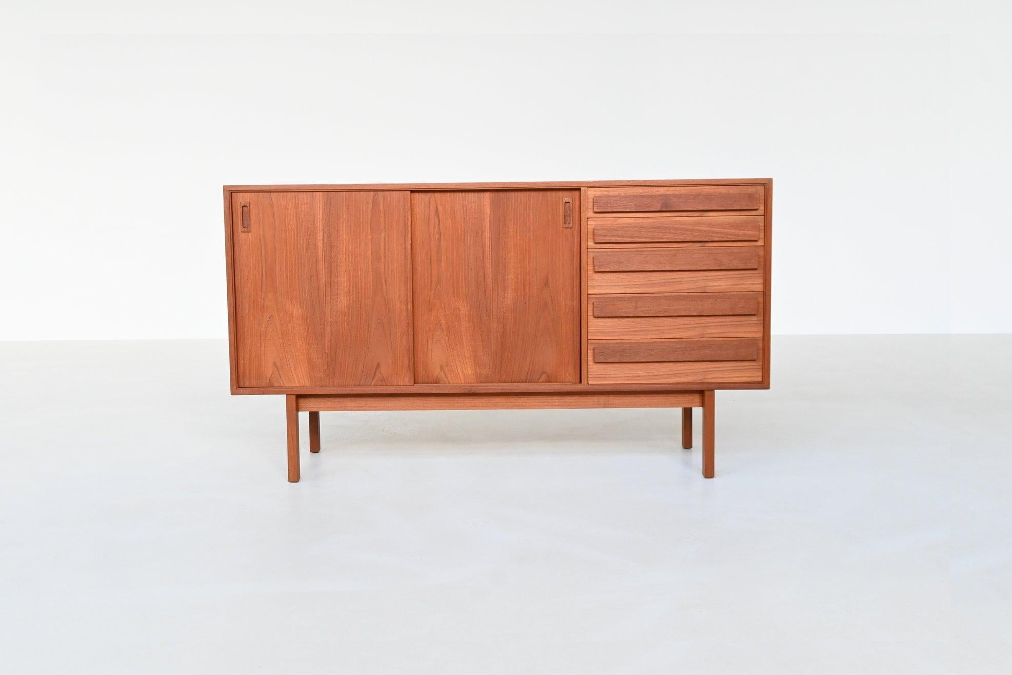 Beautiful shaped small sideboard designed by Anton Borg for Randers Møbelfabrik in Denmark, 1960. A quintessential example of Danish Mid-Century Modern design, it combines functional clarity with a warm material expression.

The piece is crafted in