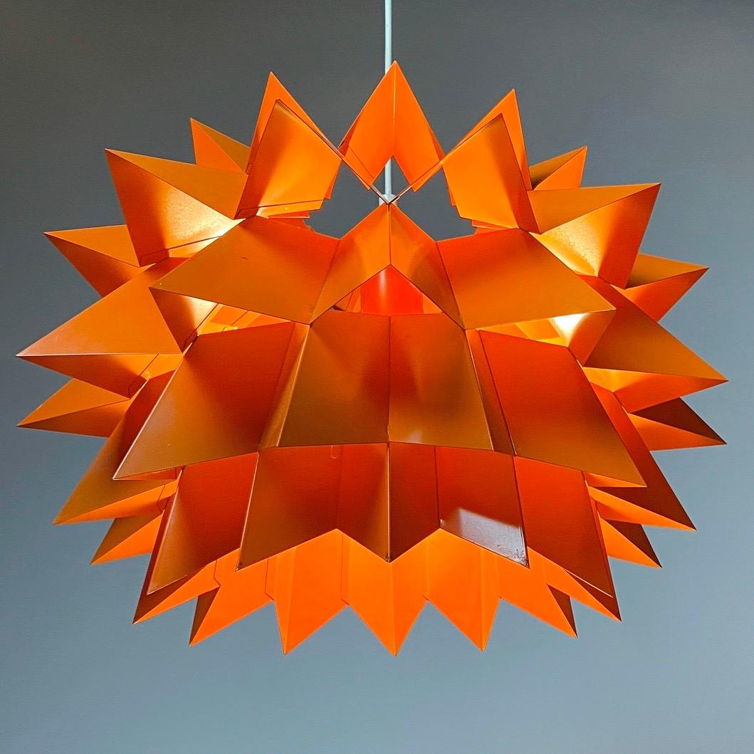 Presenting the iconic starlight or Sydney light by Anton Fogh Holm and Alfred Andersen for Nordisk Solar Compagni, Denmark, 1968.

Super rare and original orange lacquered metal ceiling light.

Eye-catching Danish design whether lit or
