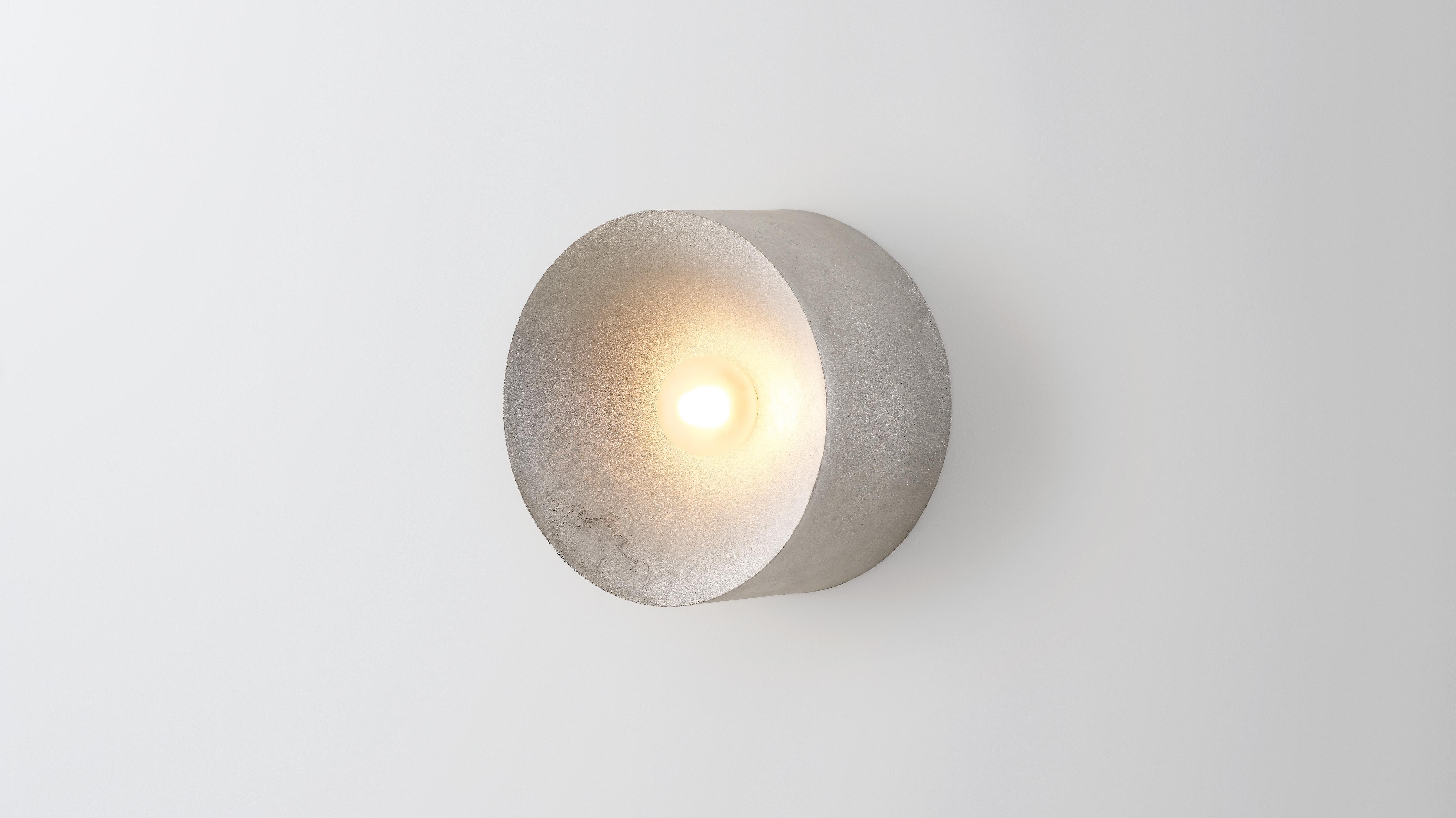 Anton in aluminium by Volker Haug
Anton series
Dimensions: W 18, H 18, D 10.3 cm
Materials: Cast aluminium
Finish: Raw 
Lamp: G9 LED (240V / 120V US). 12V option available
Glass bulb: 4.5 cm Ø, frosted
Weight: 1.5kg

Form follows force. The Anton