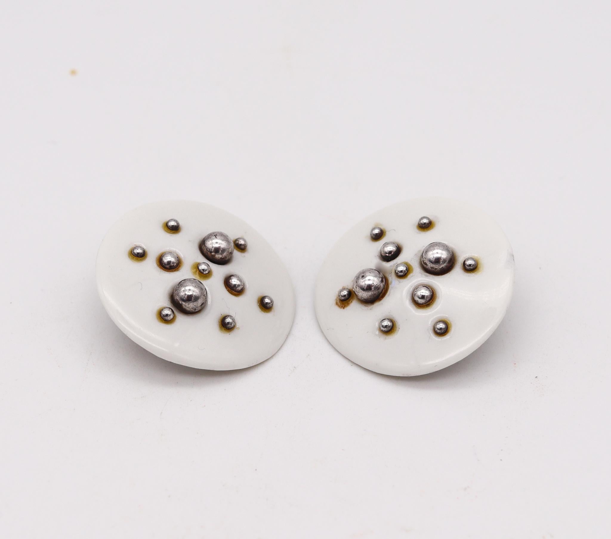 Spatialism earrings designed by Anton Michelsen for Royal Copenhagen.

A vintage modernist geometric earrings, created in Denmark by Anton Michelsen for the porcelain company of Royal Copenhagen, back in the 1960's. These pair of clips earrings has