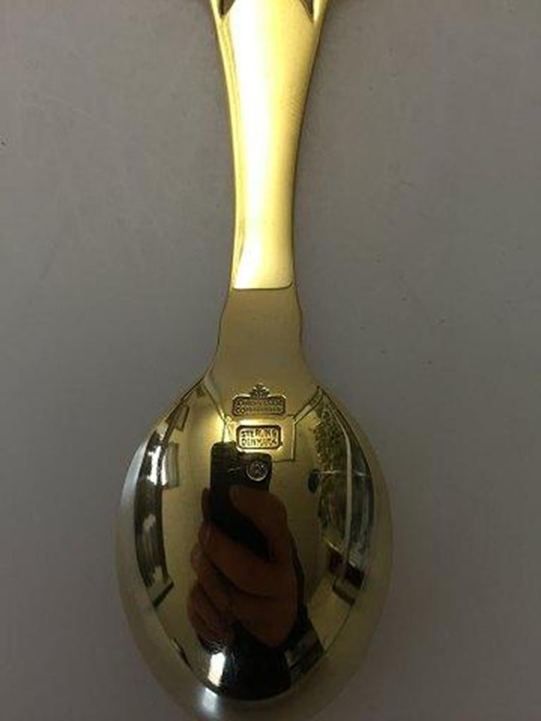 Anton Michelsen Commemorative spoon in gilded sterling silver from 1912.

For the occation of Christian X Crowning, 15 Maj 1912.
Designed by: Hans Tegner.
       