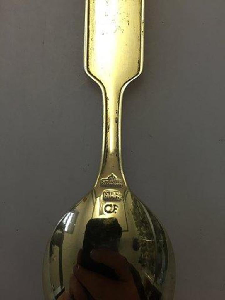 Anton Michelsen Commemorative spoon in gilded sterling silver from 1960.

For the occation of Frederik IX & Queen Ingrid's Silver Wedding Anniversary, 24 Maj 1960.
Designed by: Carsten Frølich.
   