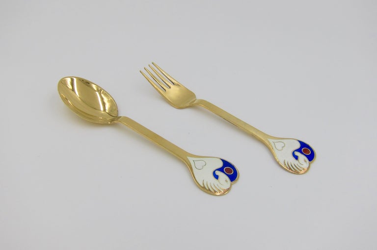 A Danish gilt sterling silver and enamel Christmas fork and spoon set from Anton Michelsen of Copenhagen, Denmark. Vibeke Alfelt (1934-1999) created this 