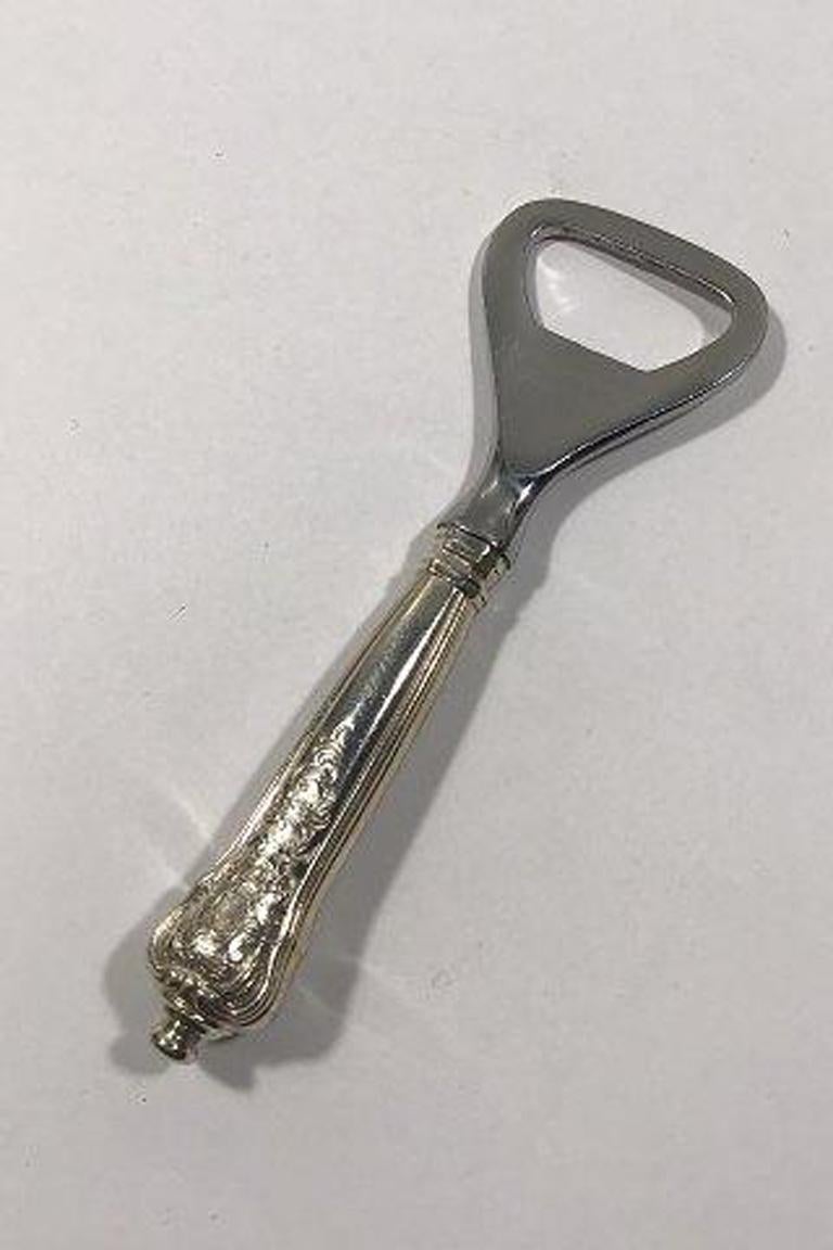 Anton Michelsen Rosenborg sterling silver bottle opener.

Measures 12 cm( 4 23/32 in).