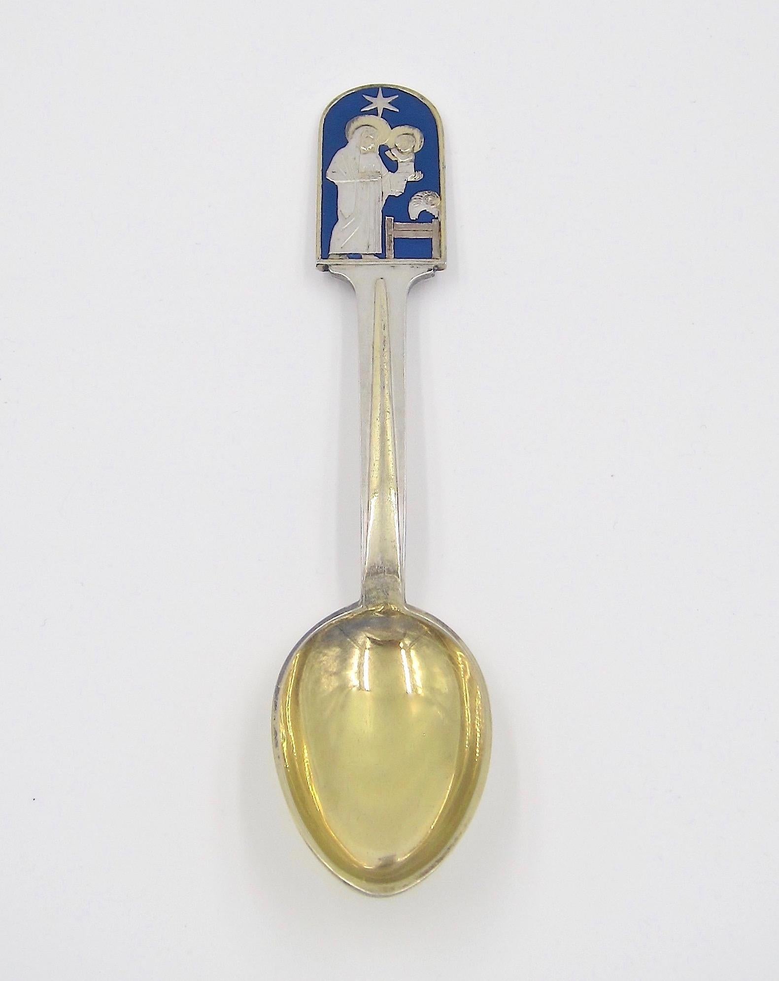 A Danish sterling silver and enamel Christmas spoon from Anton Michelsen of Copenhagen, Denmark. This 